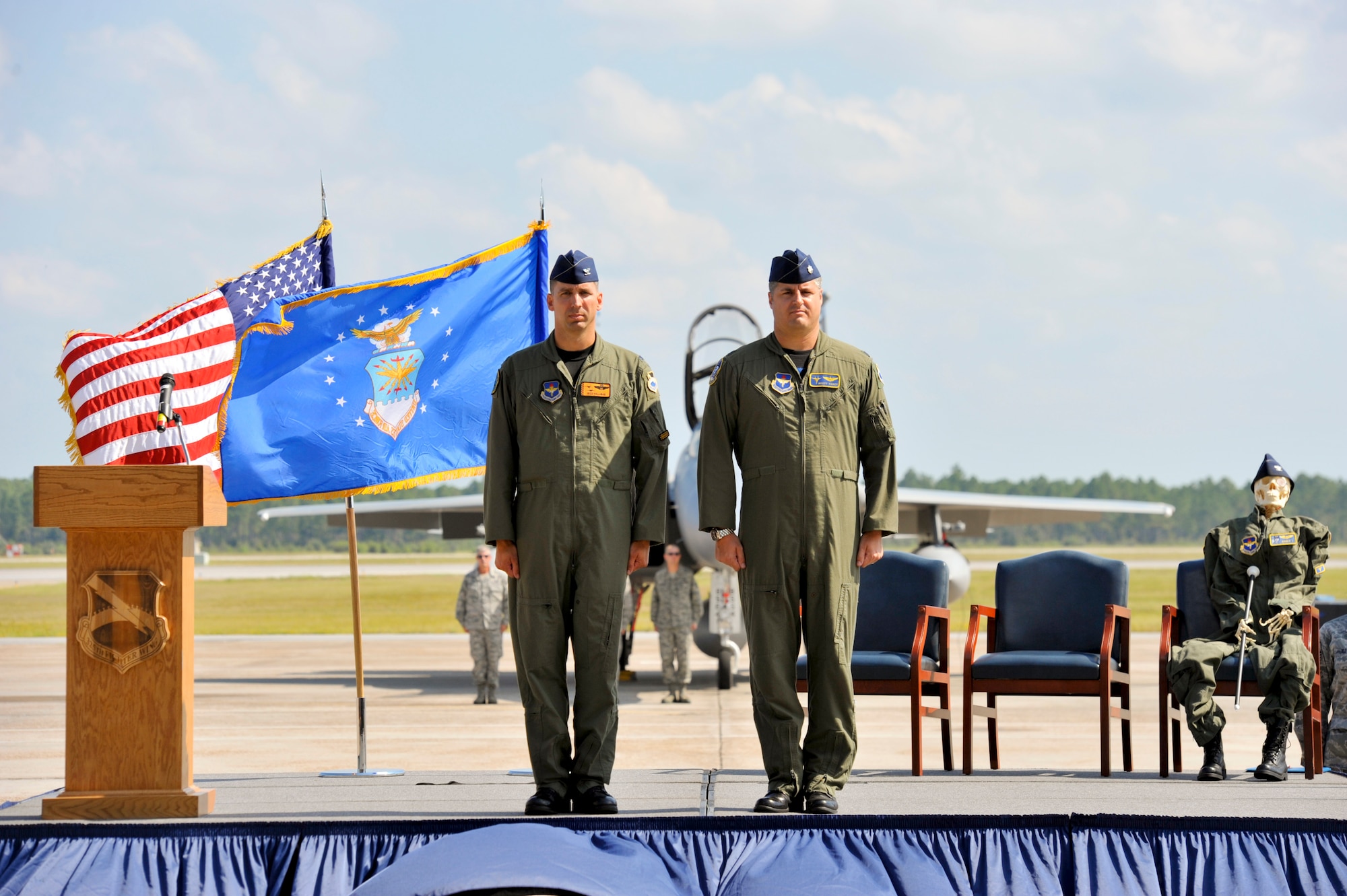 Col. Wesley Hallman, 325th Operations Group commander, Lt. Col. Scott Yancy, 95th Fighter Squadron,  and Mr. Bones, 95th Fighter Squadron mascot, honor the 95th Fighter Squadron in its inactivation Sept. 21. (U.S. Air Force photo by Jonathan Gibson)