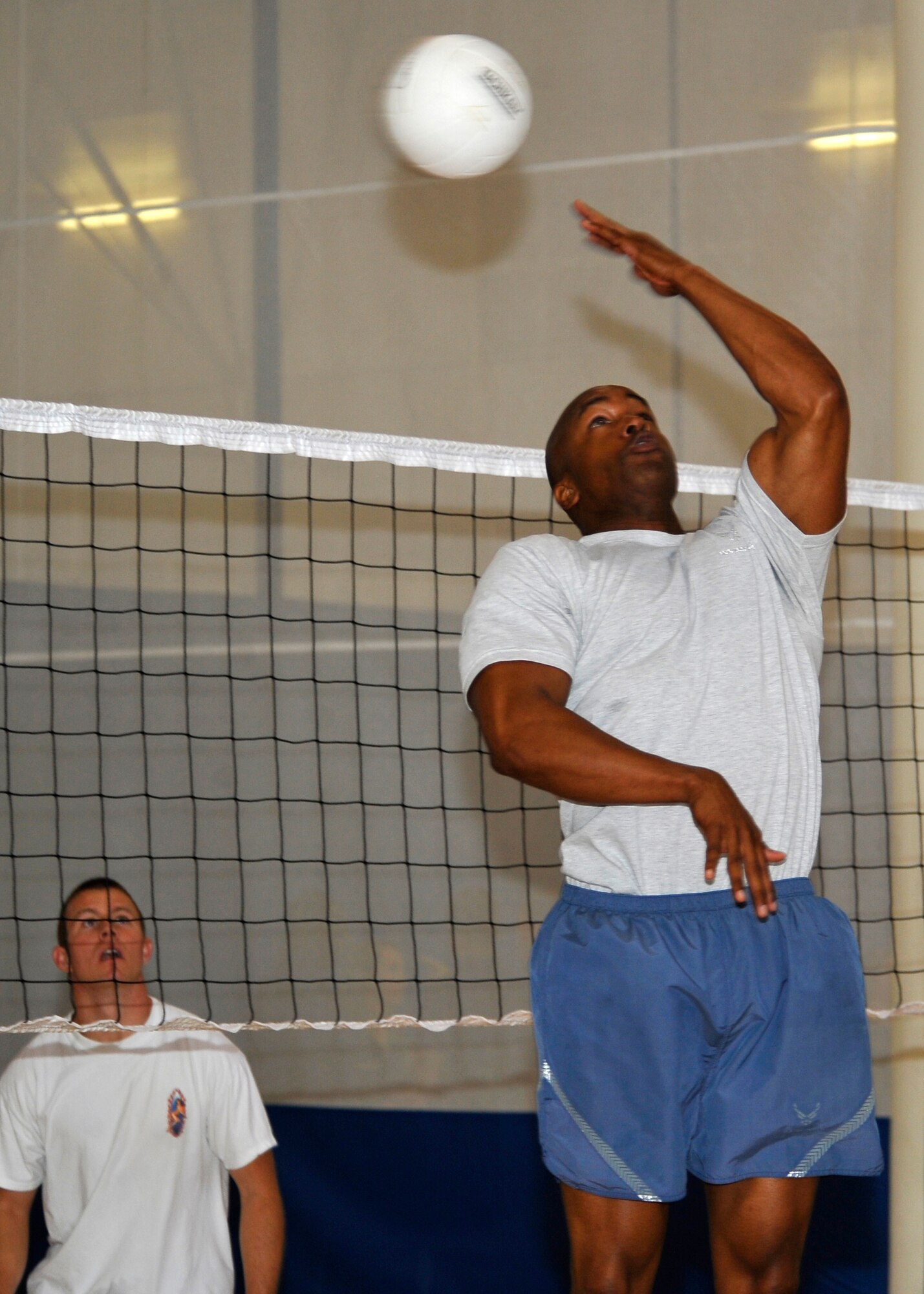 HOLLOMAN AIR FORCE BASE, N.M. -- Master Sgt. Antoine Washington, 49th Security Forces Squadron, bumps a volleyball over the net during Sports Day, Sept. 17, 2010. Airmen from different squadrons started off Sports Day with a Wing fun run, followed by other activities such as basketball, racquetball and bowling. (U.S. Air Force photo by Senior Airman Veronica Stamps / Released)