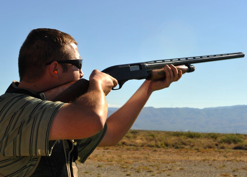 HOLLOMAN AIR FORCE BASE, N.M. -- Staff Sgt. Daniel Bauersmith, 49th Aircraft Maintenance Squadron, shoots his Winchester 1300 during the skeet shooting competition at the Apache Sports Range on Sports Day Sept. 17, 2010. Airmen used their own shot guns to compete against one another to see who could shoot the most skeet without missing. Sports Day included more than athletic competition, it also offered bed races and Tug-of-War competitions. (U.S. Air Force photo by Senior Airman Veronica Stamps / Released)