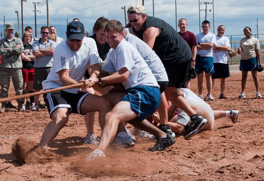 HOLLOMAN AIR FORCE BASE, N.M. -- Col. David Krumm, 49th Wing commander, leads members of the 49th WG staff during the Tug of War competition on Sports Day Sept. 17, 2010. Sports Day is an annual event held by the Domenici Fitness and Sports Center, which allows personnel from different squadrons to compete against one another for awards and trophies. (U.S. Air Force photo by Airman 1st Class Joshua Turner / Released)