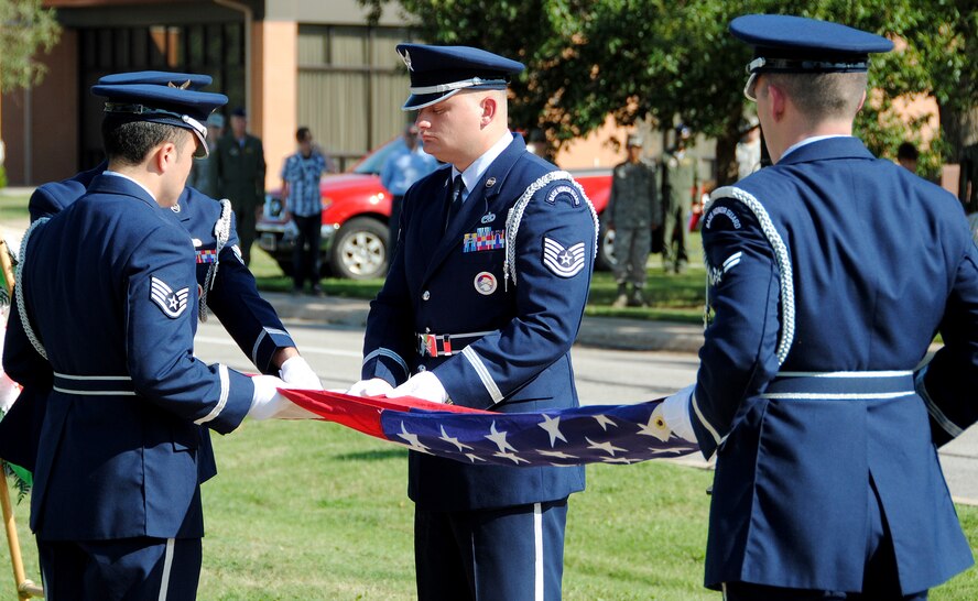 The Vance honor guard folds the flag in honor of missing and captured servicemembers during a POW/MIA Day ceremony Sept 17 at Vance AFB. (U.S. Air Force Photo/ 2nd Lt. Tyler Gross)