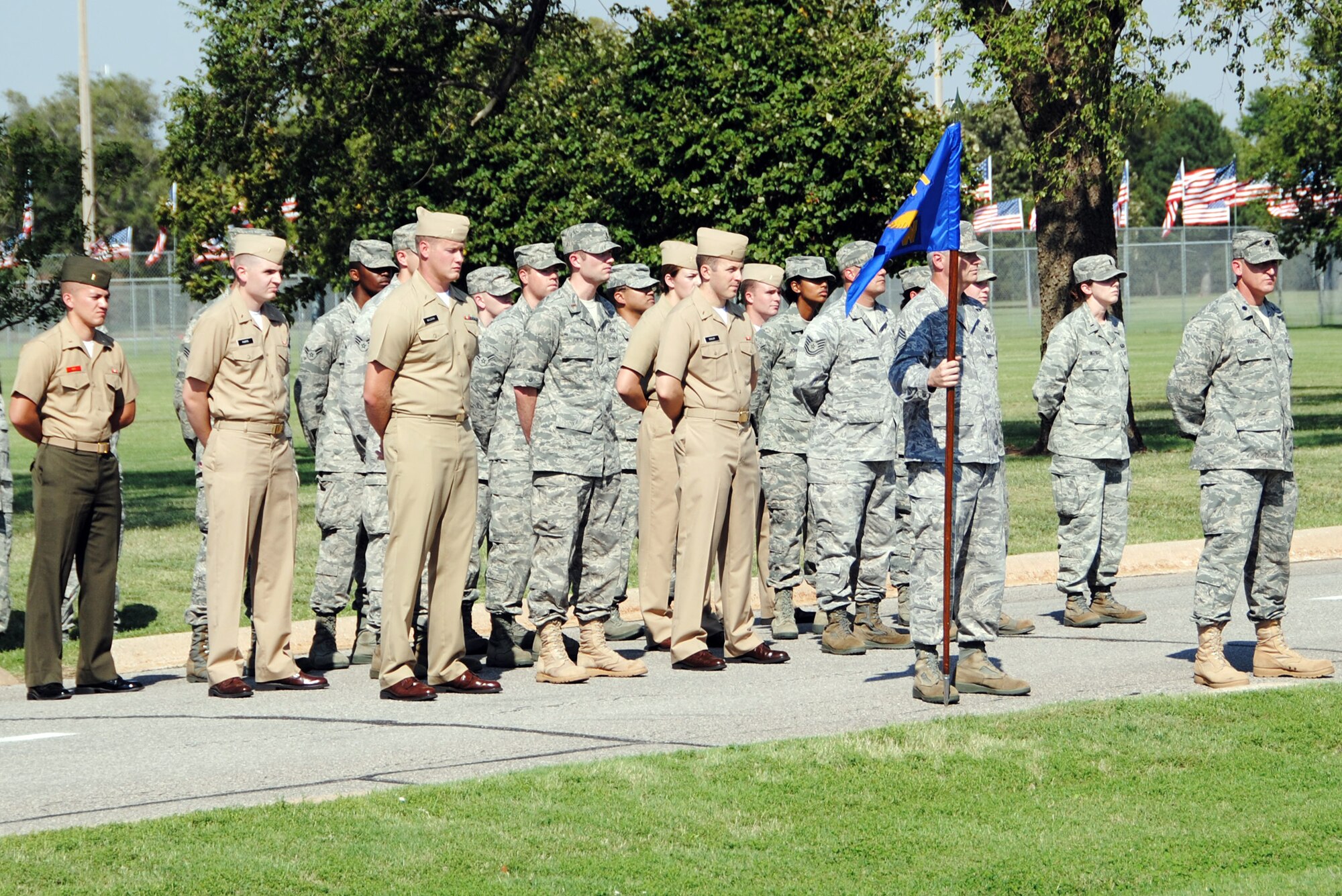 Navy, Marines and Air Force members form up to honor missing and captured comrades during a POW/MIA Day ceremony Sept 17 at Vance AFB. (U.S. Air Force Photo/ 2nd Lt. Tyler Gross)