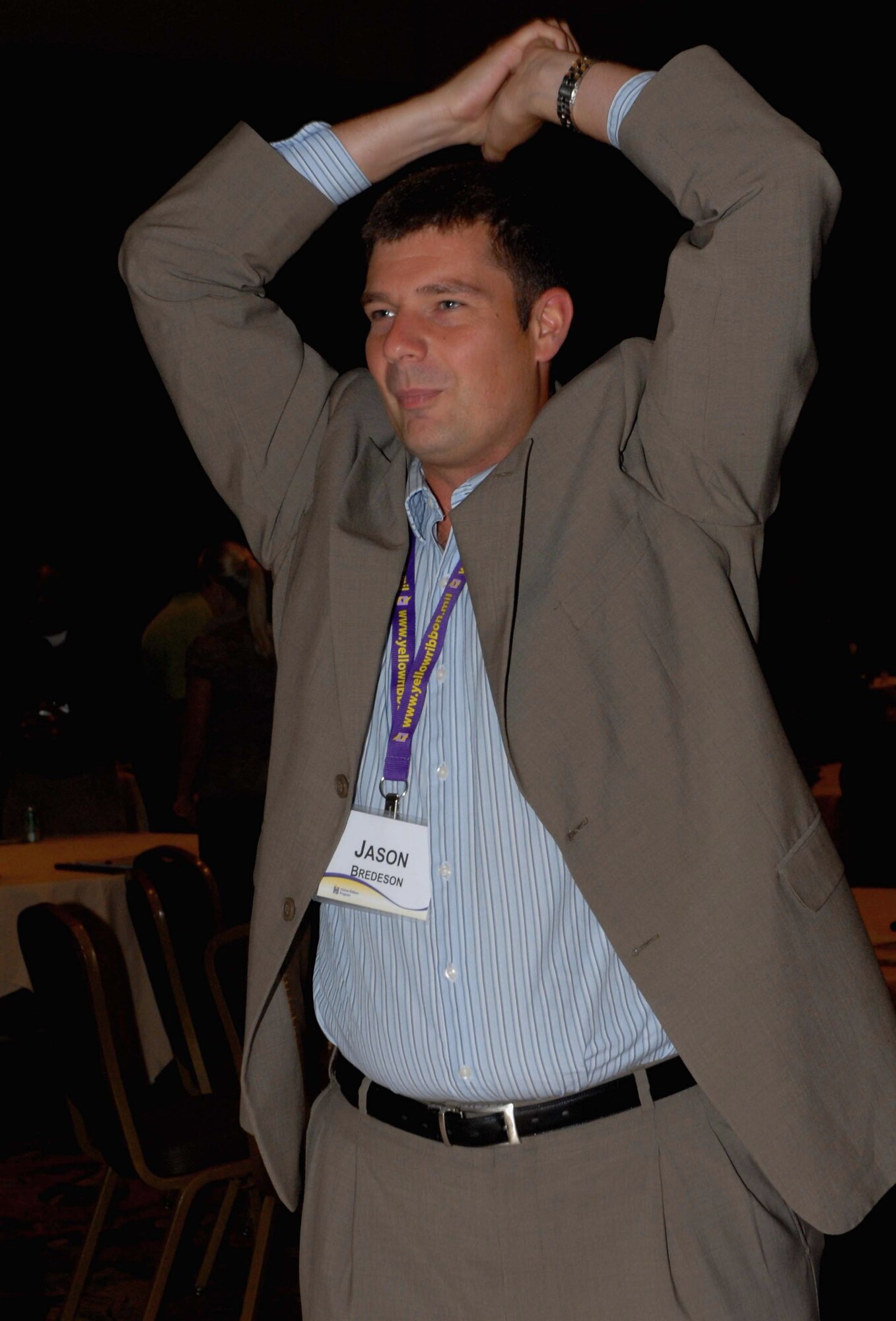 Capt. Jason Bredeson, the 940th Wing Chaplain, stretches during an icebreaker session at a Yellow Ribbon program conference held in Orlando, Fla. The conference provided an opportunity for those who work with Yellow Ribbon to learn how to improve the program. (U.S. Air Force photo by Tech. Sgt. Kenneth McCann)

