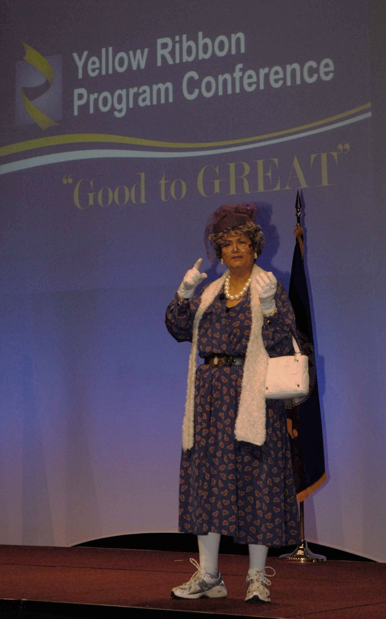 Master Sgt. Pamela Silas, of Travis AFB, plays her Mother Weebee character before an audience at a Yellow Ribbon Program conference held in Orlando, Fla. The conference provided an opportunity for those who work with Yellow Ribbon to learn how to improve the program. (U.S. Air Force photo by Tech. Sgt. Kenneth McCann)
