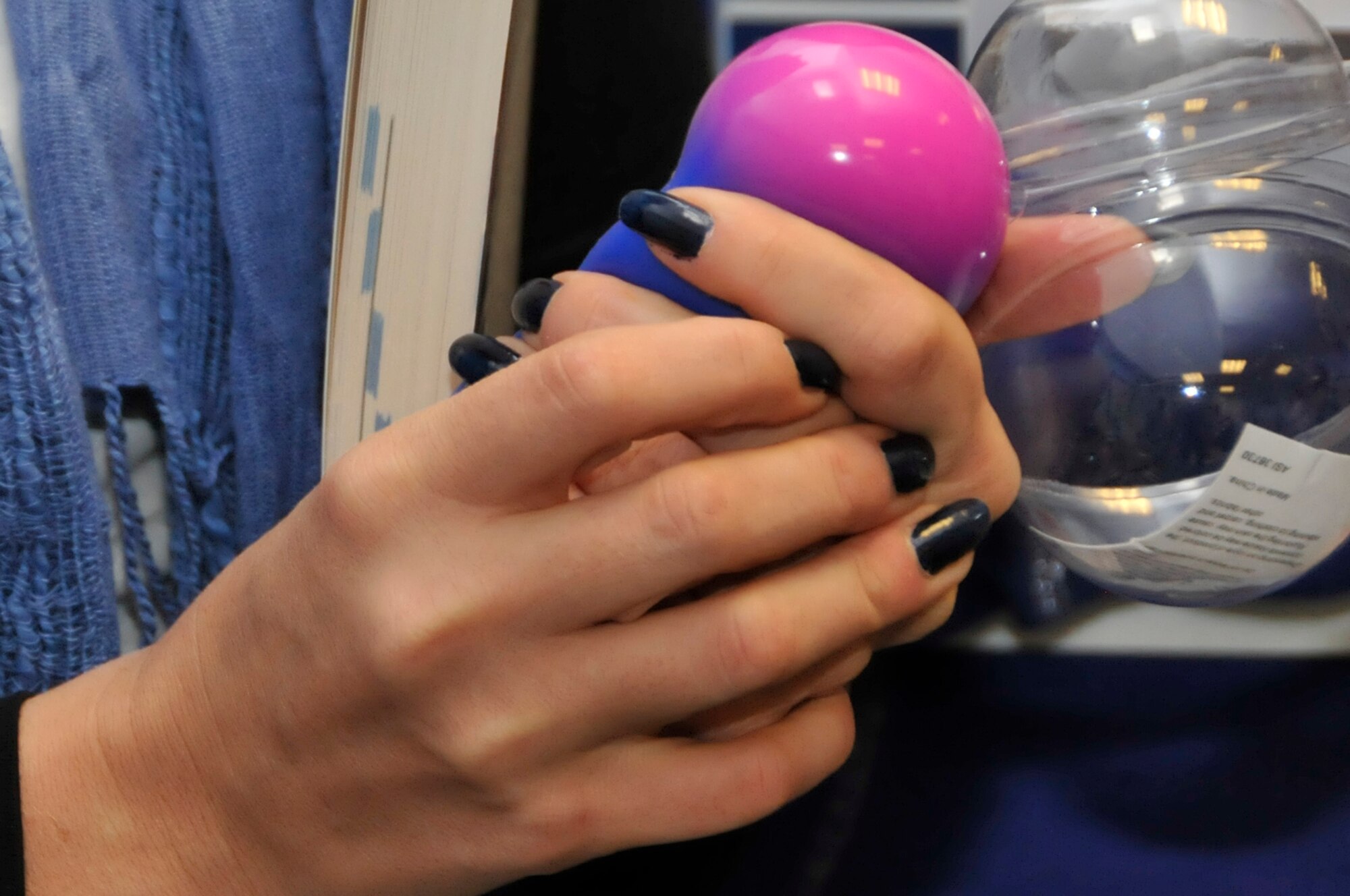 A Child Development Center worker squeezes a stress ball during the ‘care for the care giver’ training at CDC West Sept. 18.  The training consisted of three different stations including stress management, immunization and back lifting safety (U.S. Air Force photo/Airman 1st Class Eboni Knox) 