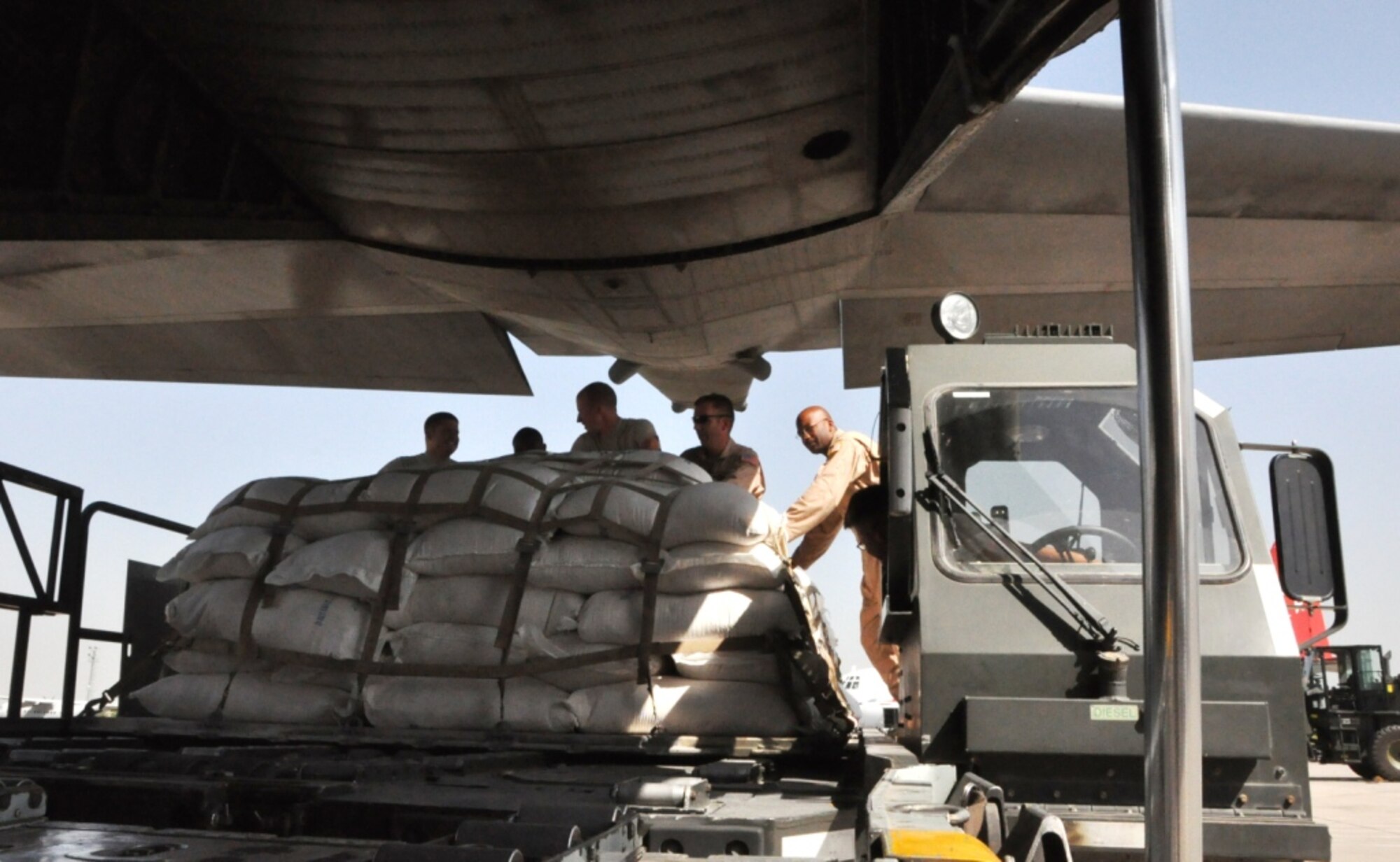 CHAKLALA, Pakistan -- Members of the U.S. Air Force's 621th Contingency Response Wing in Pakistan load a U.S. Air Force C-130 Hercules with pallets of flood relief supplies Sept. 20 at Pakistan Air Force Base Chaklala. The CRE deployed from the 621st Contingency Response Wing, Joint Base McGuire-Dix-Lakehurst, N.J., to augment operations at the Pakistan Air Force's Central Flood Relief Cell at the air base. To date, U.S. military personnel and aircraft, working in partnership with the Pakistan military, have delivered more than 3.8 million kilograms of relief supplies and rescued more than 16,000 people throughout the flood-stricken areas of Pakistan. (U.S. Air Force photo/Staff Sgt. Kali L. Gradishar)


