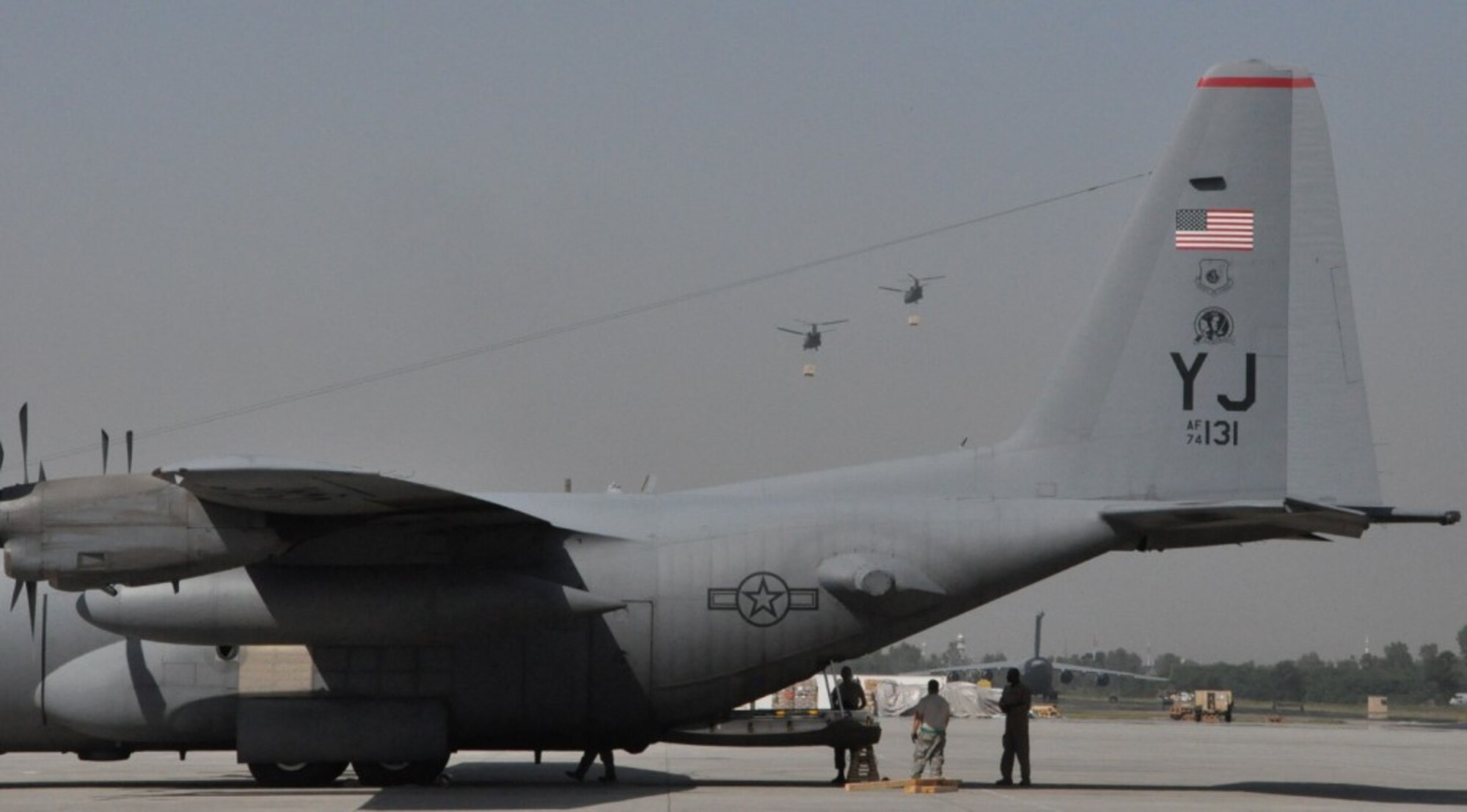 Chaklala, Pakistan - Members of the U.S. Air Force 618th Contingency Response Element in Pakistan prepare for the arrival of flood relief supplies to load a U.S. Air force C-130 Hercules Sept. 20 at Pakistan Air Force Base Chaklala. The CRE deployed from the 621st Contingency Response Wing, Joint Base McGuire-Dix-Lakehurst, N.J., to augment operations at the Pakistan Air Force's Central Flood Relief Cell at the air base. To date, U.S. military personnel and aircraft, working in partnership with the Pakistan military, have delivered more than 3.8 million kilograms of relief supplies and rescued more than 16,000 people throughout the flood-stricken areas of Pakistan. (U.S. Air Force photo/Staff Sgt. Kali L. Gradishar)
