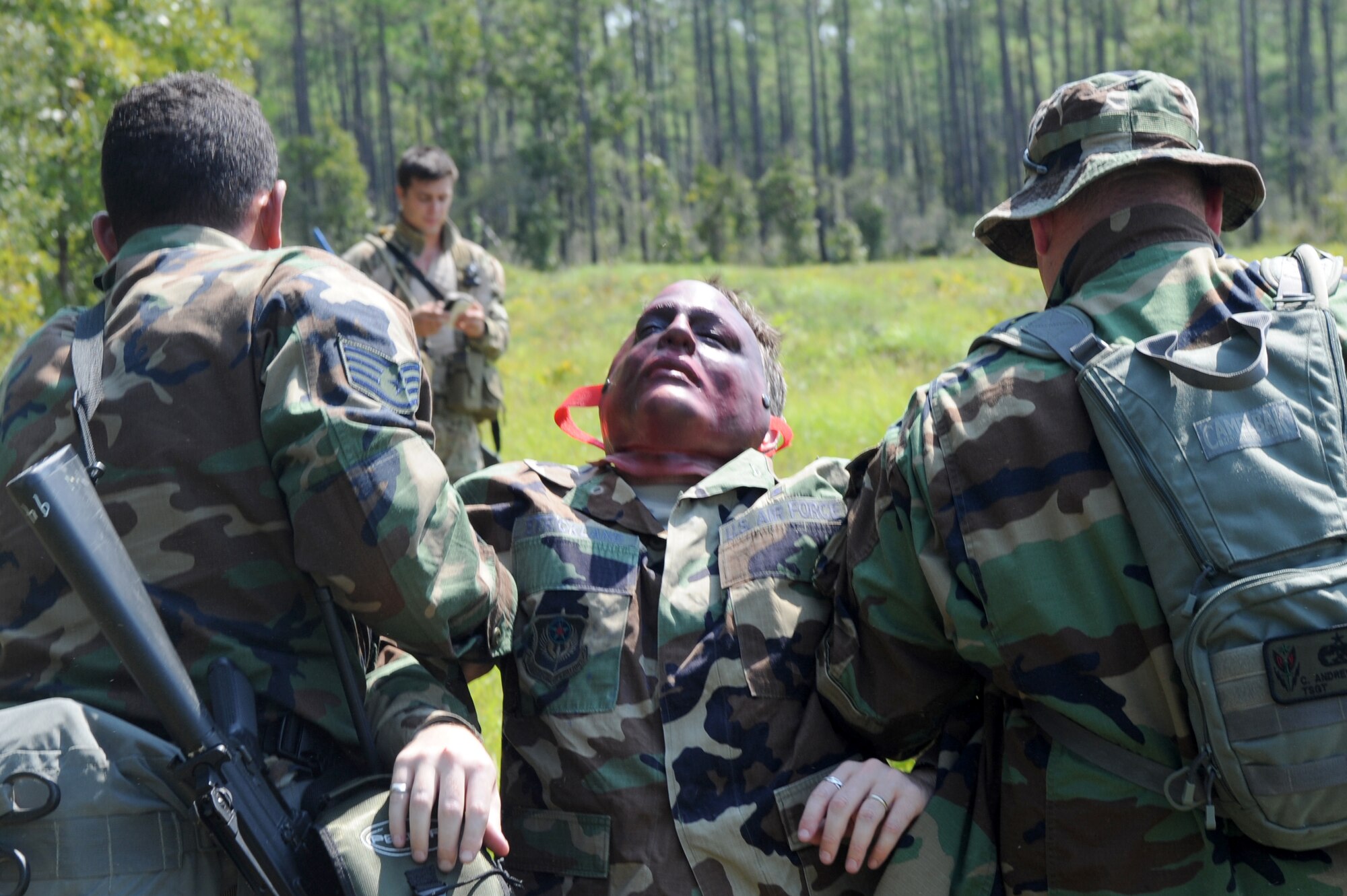 U.S. Air Force medics from the 1st Special Operations Support Squadron transport a simulated victim to a designated location to receive treatment during a medical exercise on the Eglin range, Fla., Sept. 14, 2010. The purpose of the exercise is to prepare and train medics for a deployed environment. (DoD photo by U.S. Air Force Airman 1st Class Caitlin O'Neil-McKeown/RELEASED)