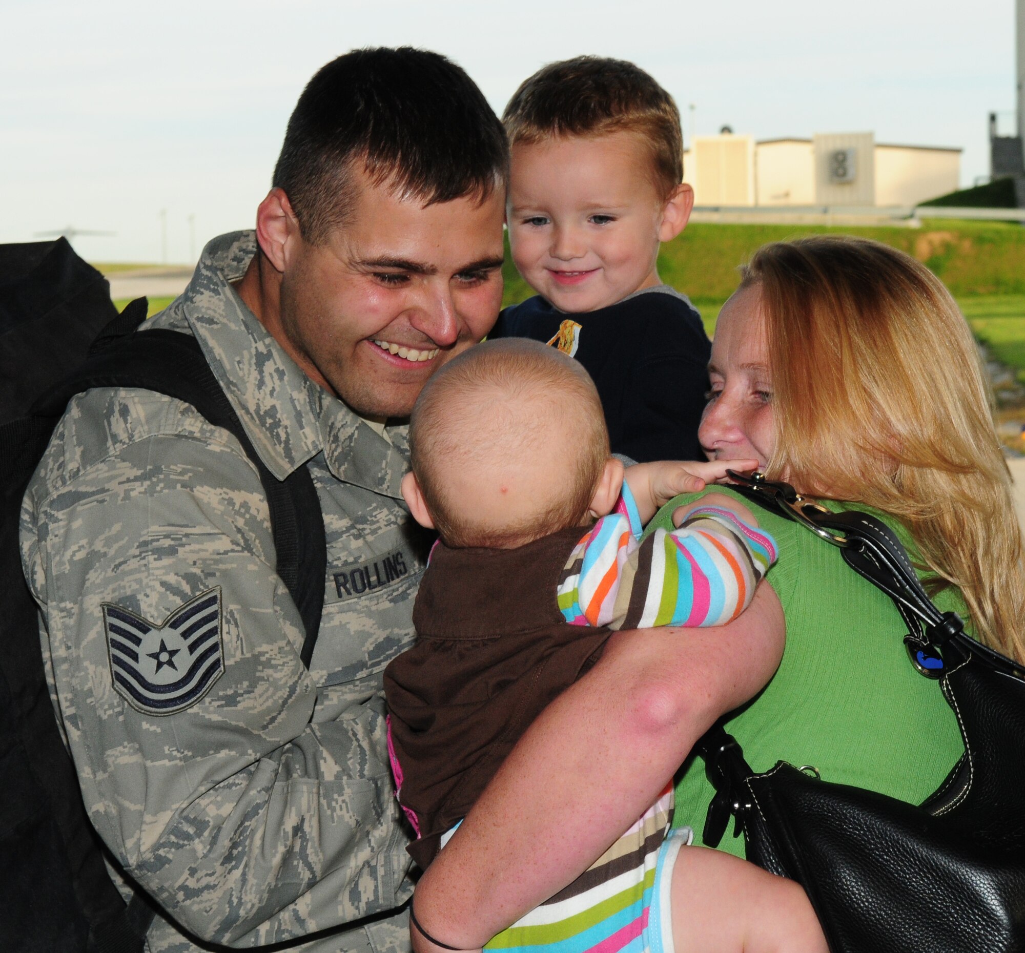 SPANGDAHLEM AIR BASE, Germany – Tech. Sgt. Randy Rollins, 52nd Equipment Maintenance Squadron, is greeted by his family upon returning from a deployment to Afghanistan.  Sergeant Rollins was deployed in support of the 81st Fighter Squadron.  (U.S. Air Force photo/Staff Sgt. Heather M. Norris)