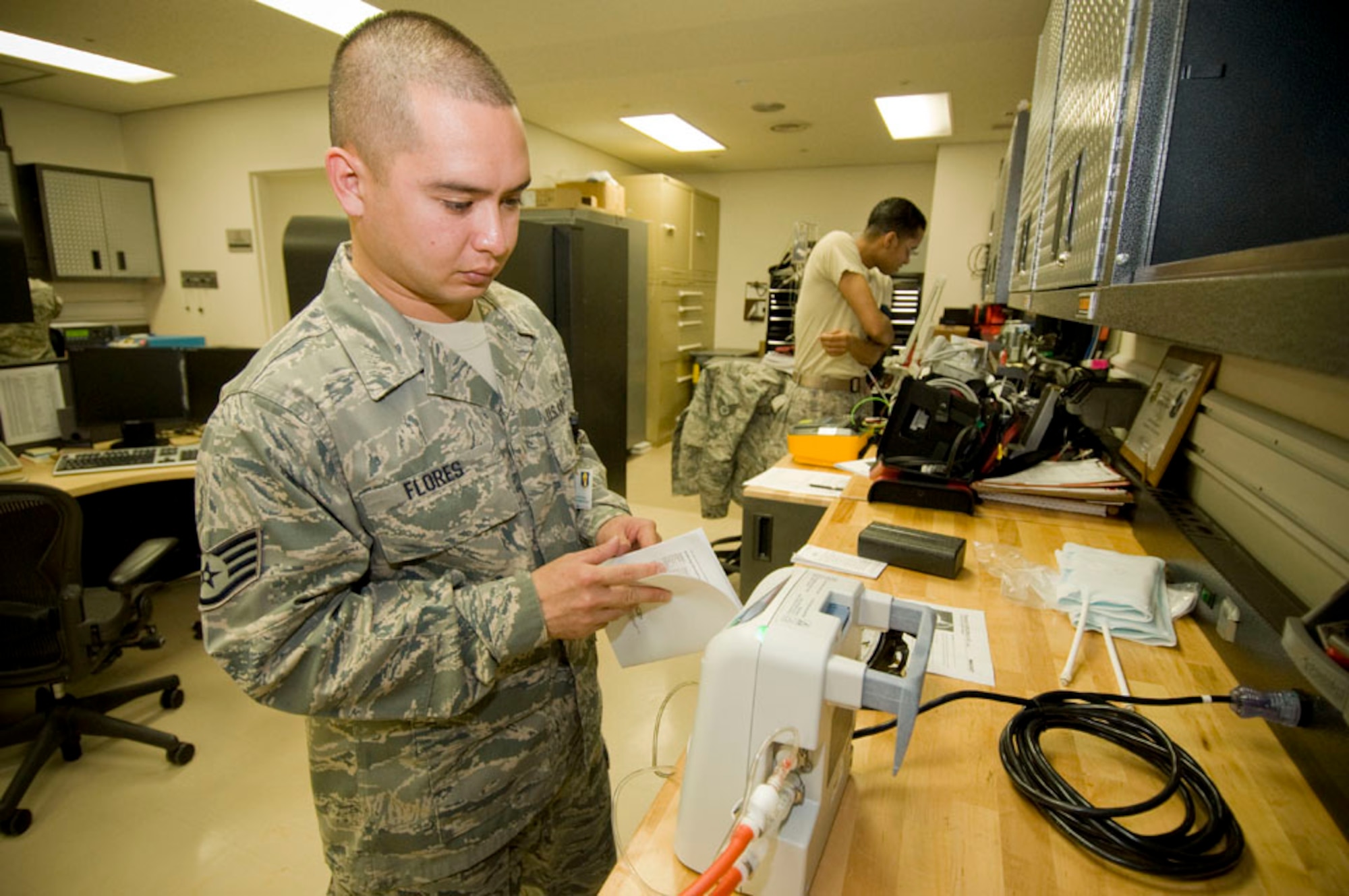 Staff Sgt. David Flores, 35th Medical Support Squadron biomedical equipment technician, calibrates medical equipment used to treat patients with deep-vein blood clots, Sept. 21, 2010, at the Misawa Air Base, Japan, hospital. The device is often used to keep blood flowing in the legs of bed-ridden patients or during surgery. The Guam native works at one of 83 active-duty Air Force BMETs shops. (U.S. Air Force photo by Senior Airman Jessica Lockoski/Released)