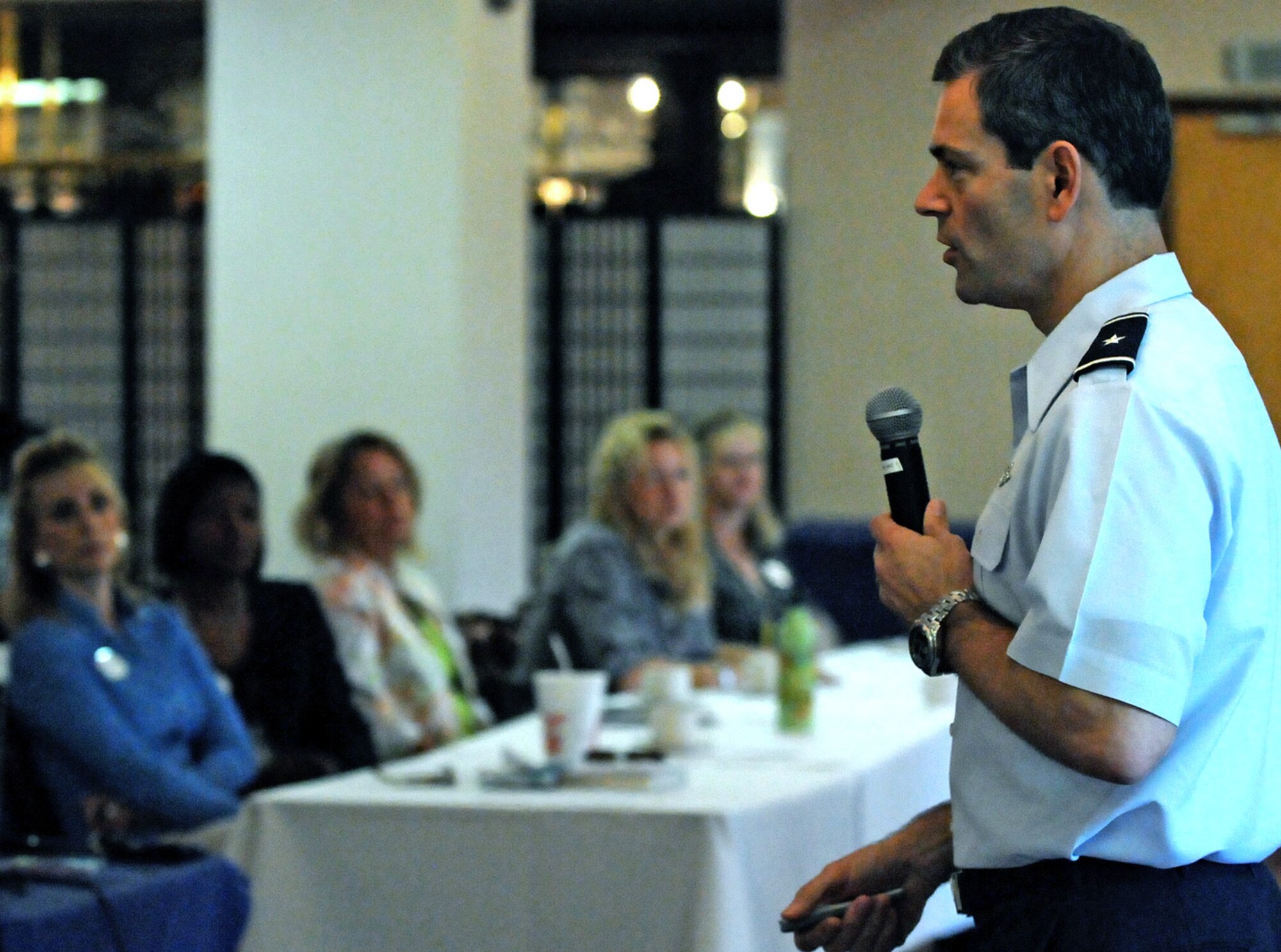 Brig. Gen. Ken Wilsbach, 18th Wing commander, talks with dozens of spouses during the quarterly leadership spouses forum Sept. 20. In addition to the wing's mission briefing, spouses of base leaders were given a chance to ask questions and voice their concerns about base issues to the general. (Air Force/Staff Sgt. Jason Lake)