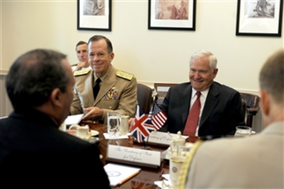 Secretary of Defense Robert M. Gates and Chairman of the Joint Chiefs of Staff Adm. Mike Mullen meet with British Defense Minister Liam Fox in the Pentagon on Sept. 22, 2010.  