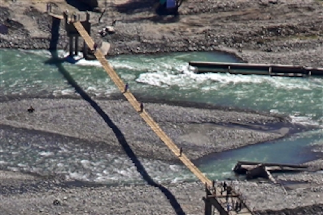 An aerial photo from a U.S. Army CH-47 Chinook helicopter shows a temporary bridge in Swat Valley, Pakistan, Sept. 20, 2010. The CH-47 crew is assigned to the 16th Combat Aviation Brigade. The U.S. military is providing disaster relief and assistance following massive flooding in the country.