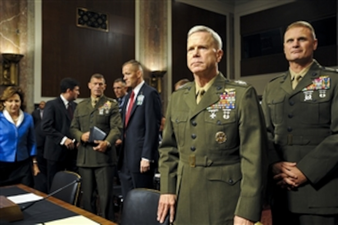 U.S. Marine Corps Gen. James F. Amos, second from right, assistant commandant of the Marine Corps, prepares to address the U.S. Senate for reappointment to the grade of general and to be commandant of the Marine Corps in Washington, D.C., Sept. 21, 2010.