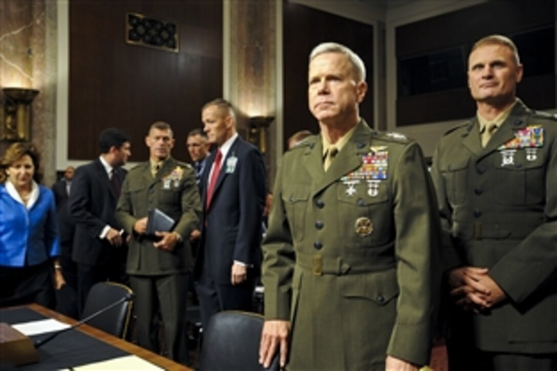 U.S. Marine Corps Gen. James F. Amos, second from right, assistant commandant of the Marine Corps, prepares to address the U.S. Senate for reappointment to the grade of general and to be commandant of the Marine Corps in Washington, D.C., Sept. 21, 2010.