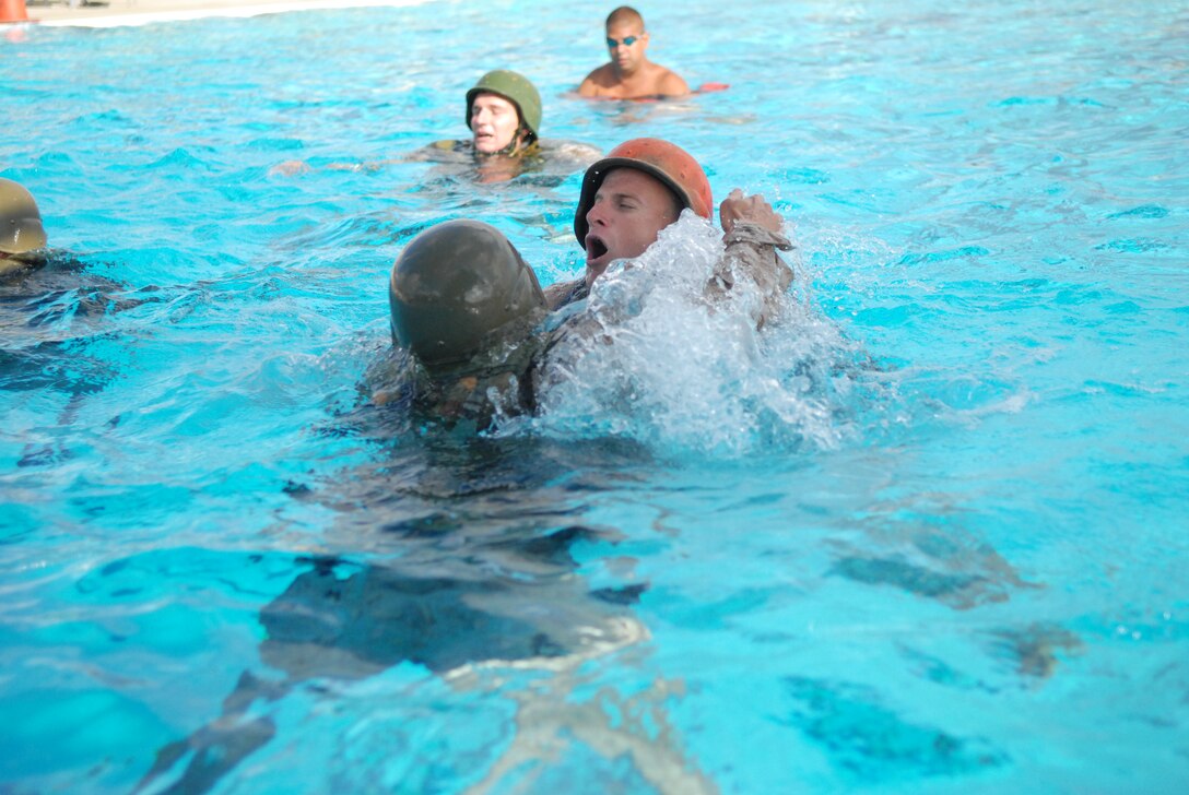 Staff Sgt. Jared Kiesow, drill instructor, Company K, 3rd Recruit Training Battalion, Recruit Training Regiment performs the role of a simulated victim during the Marine Corps Instructor of Water Survival course at Marine Corps Air Station Miramar, Calif., Sept.22.