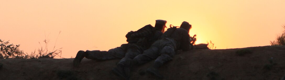 Marines with Company E, 2nd Battalion, 8th Marine Regiment offer support fire for a company-wide assault on range 24, here, recently.  The exercise offered Marines a more extensive look into how the unit will operate at the company level.