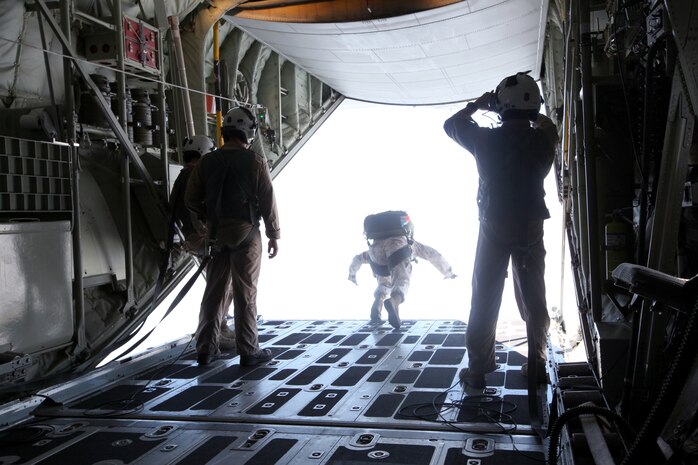 A Marine from 2nd Reconnaissance Battalion jumps out of a C-130 Hercules as part of a pre-deployment training Sept. 23, 2010, aboard Camp Lejeune, N.C.  The exercise offered the opportunity for the Marines to learn how drop procedures work and how to clear a drop zone for air deliveries and perform static line jumps as well as military freefall. (U.S. Marine Corps photo by Lance Cpl. Bruno J. Bego)