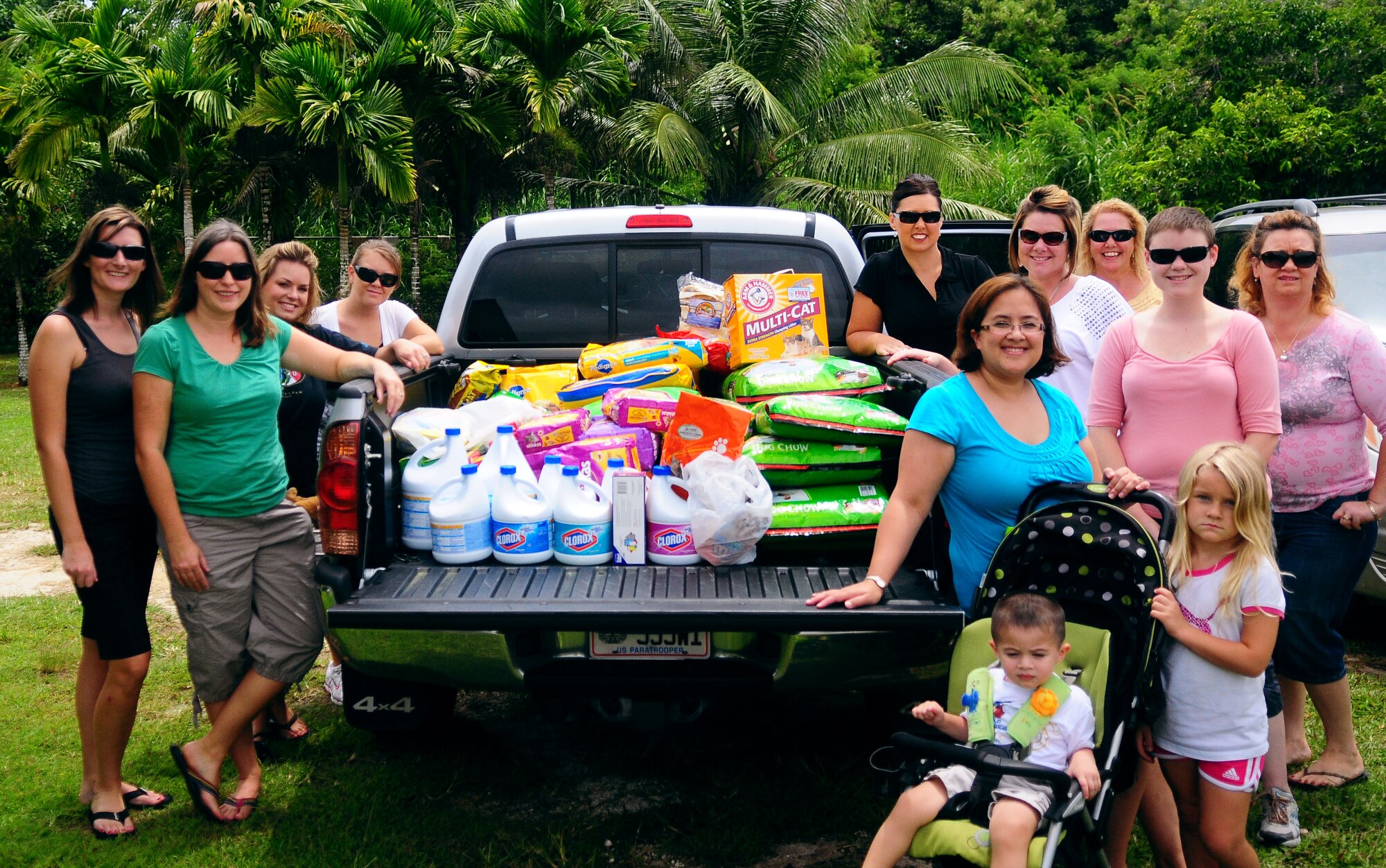 Members of the Enlisted Spouse’s Club donate food and supplies to Guam Animals In Need in Yigo Sept. 21. The shelter was robbed in early Sept. and more than 600 pounds of dog and cat food was stolen. (U.S. Air Force photo by Airman Whitney Amstutz)