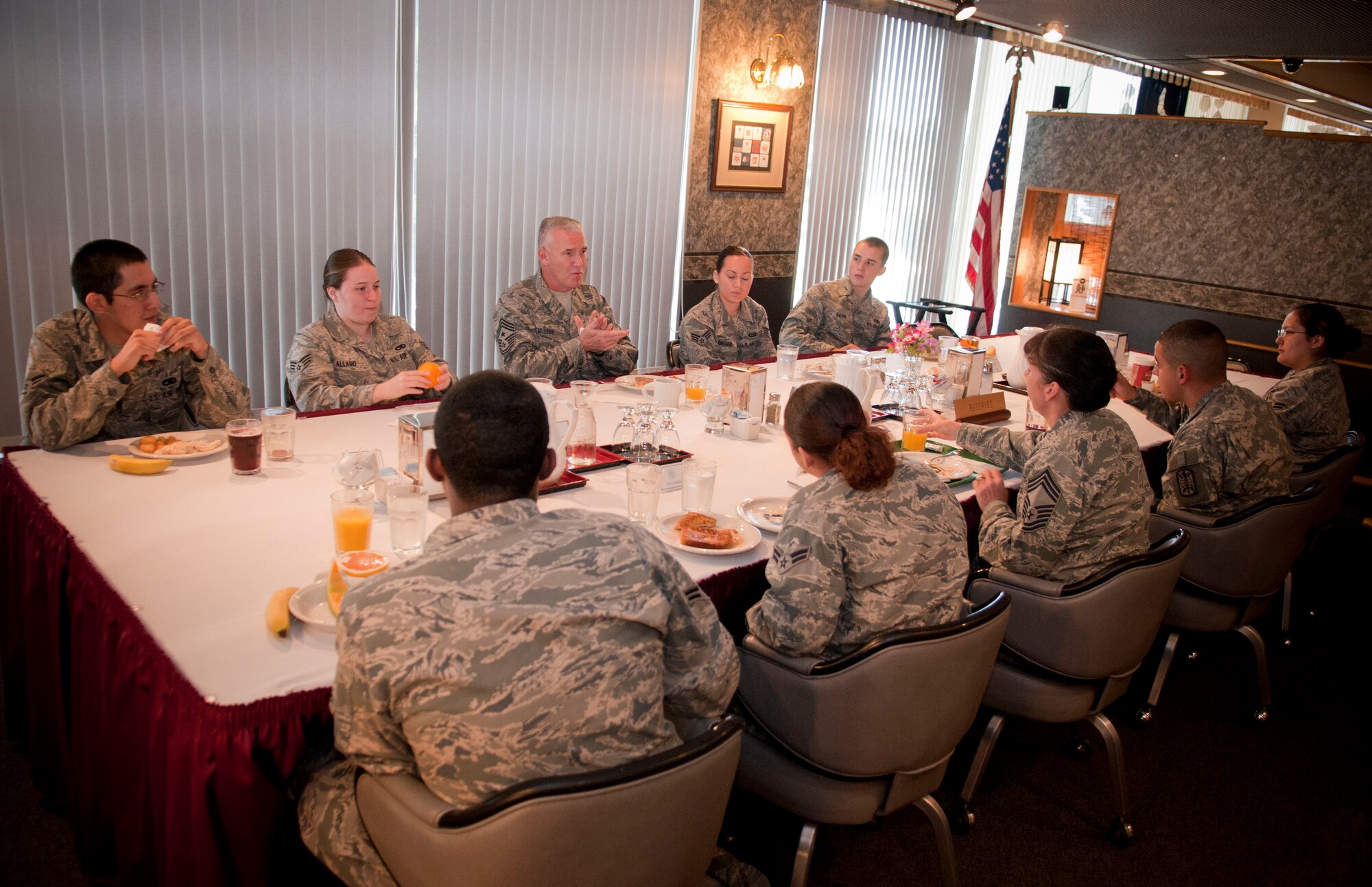 Chief Master Sgt. Brooke McLean, Pacific Air Forces Command Chief,(center) speaks to service members during breakfast at the Grissom dining facility at Misawa Air Base, Japan, Sept. 24, 2010. During his three-day visit, Chief discussed the Air Force’s hot topics with Airmen such as physical fitness tests and the Don’t Ask, Don’t Tell policy. He is scheduled to accompany Gen. Gary North, PACAF Commander, in celebrating the Air Force’s 63rd anniversary with base members at the wing’s Air Force Ball.  (U.S. Air Force photo by Senior Airman Jessica Lockoski/Released)