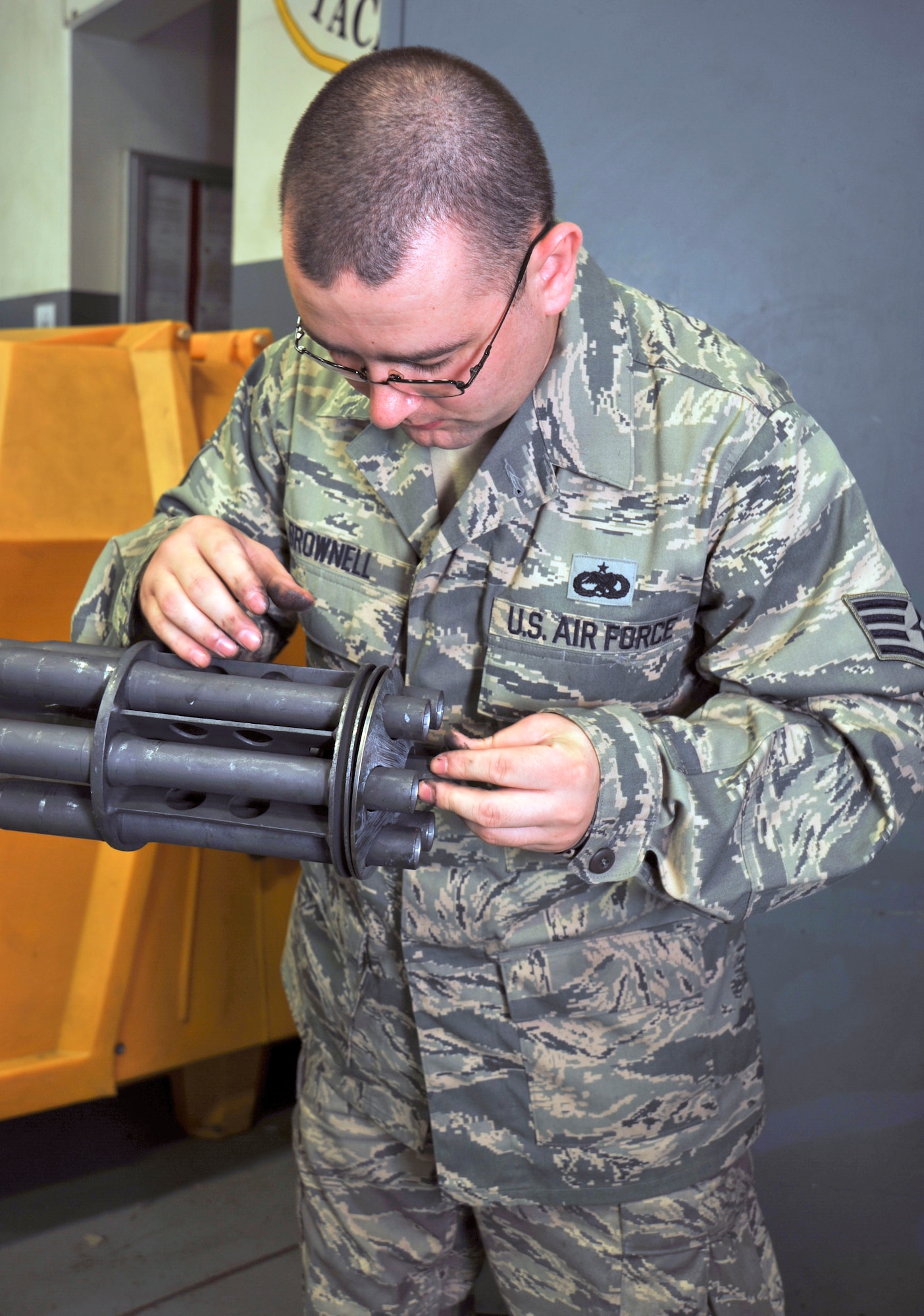 U.S. Air Force Staff Sgt. Michael Brownell, 35th Maintenance Squadron Weapons Armament Flight, repairs a Gatling gun at Misawa Air Base, Japan, Sept. 21, 2010. Pre-maintenance inspections provide safe and reliable equipment for training and real-world taskings for F-16 Fighting Falcon pilots and crew chiefs. (U.S. Air Force photo by Tech. Sgt. Russell McBride/Released)