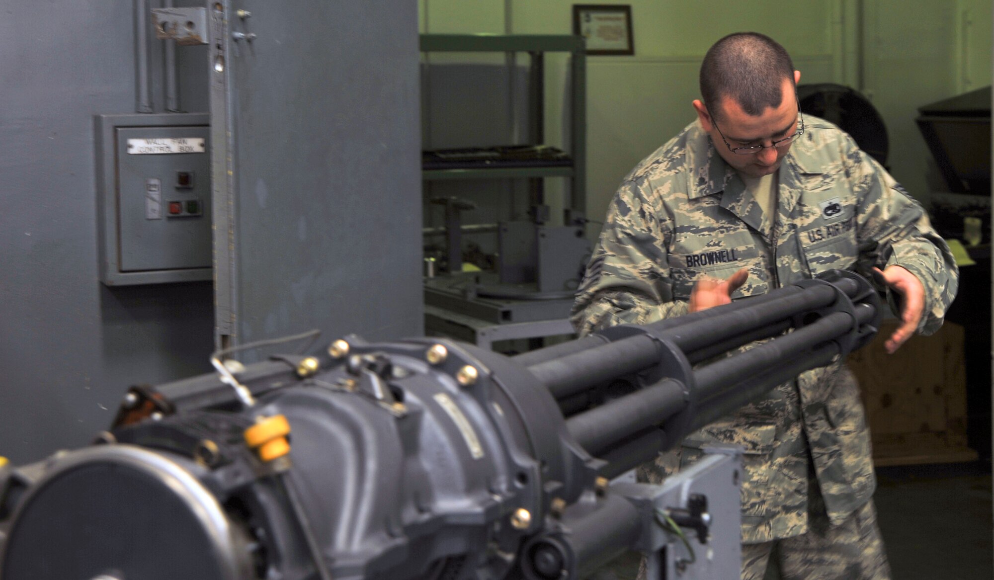 U.S. Air Force Staff Sgt. Michael Brownell, 35th Maintenance Squadron Weapons Armament Flight, repairs a Gatling gun at Misawa Air Base, Japan, Sept. 21, 2010. The gun fires the high explosive-incendiary 20mm bullets at a rate of 100 rounds per second. (U.S. Air Force photo by Tech. Sgt. Russell McBride/Released)