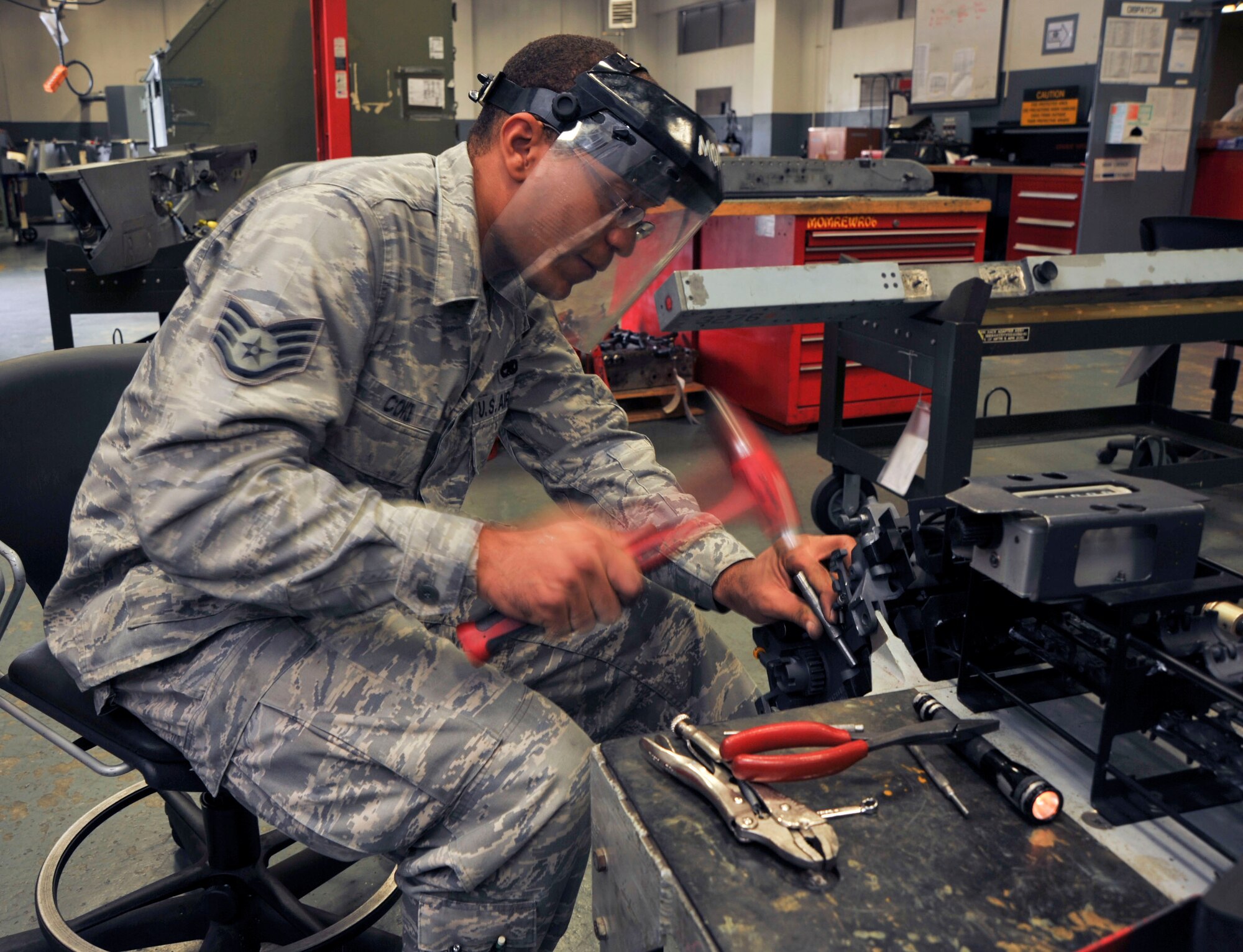 U.S. Air Force Staff Sgt. Damin Coke, 35th Maintenance Squadron Weapons Armament Flight, works on the replenisher for loading ammunition in the universal ammunition loading system at Misawa Air Base, Japan, Sept. 21, 2010. Airmen in the 35th MXS/MXMR provide safe, reliable aircraft, equipment and munitions to train the world's finest F-16 Fighting Falcon pilots and crew chiefs. (U.S. Air Force photo by Tech. Sgt. Russell McBride/Released)