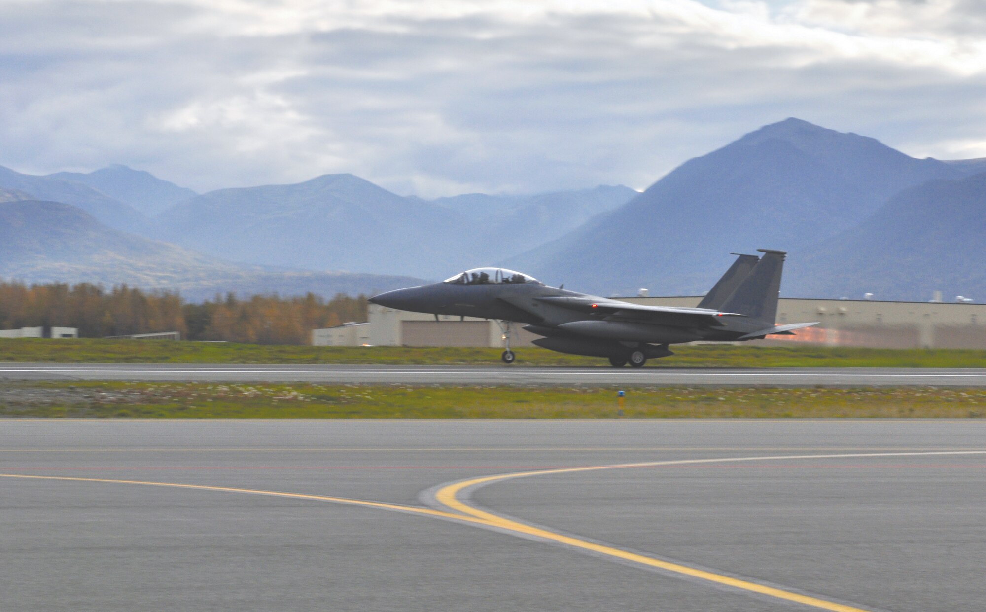 Air Force Lt. Col. Brian “Barley” Baldwin, 19th Fighter Squadron, pilots the last F-15 Eagle stationed at Joint Base Elmendorf-Richardson, an F-15D, as it takes off on its last sortie in Alaskan airspace, Tuesday. The aircraft will be re-stationed at Barnes Air National Guard Base, Mass. (Photo by Senior Airman Cynthia Spalding/JBER PAO)