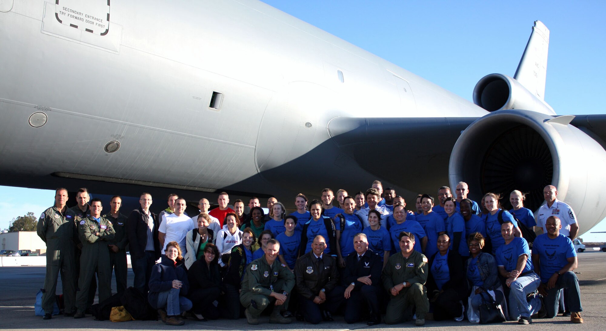 TRAVIS AIR FORCE BASE, Calif. -- Servicemembers from Travis AFB, Beale AFB, and the Presidio joined together with  Col. James Vechery, 60th Air Mobility Commander, Col. Jay Flournoy, 349th Air Mobility Commander, Col. Barrett Broussard, 349th Air Mobility Vice Commander, Command Chief Master Sgt. Daniel Fischer, 60th Air Mobility Wing and Command Chief Master Sgt. Kathleen Buckner, 349th Air Moblity Wing for a quick picture outside of a KC-10 before departing for the 14th annual Air Force Marathon at Wright-Patterson Air Force Base, Ohio on Sept. 17. (U.S. Air Force photos/Senior Airman Amelia Leonard)