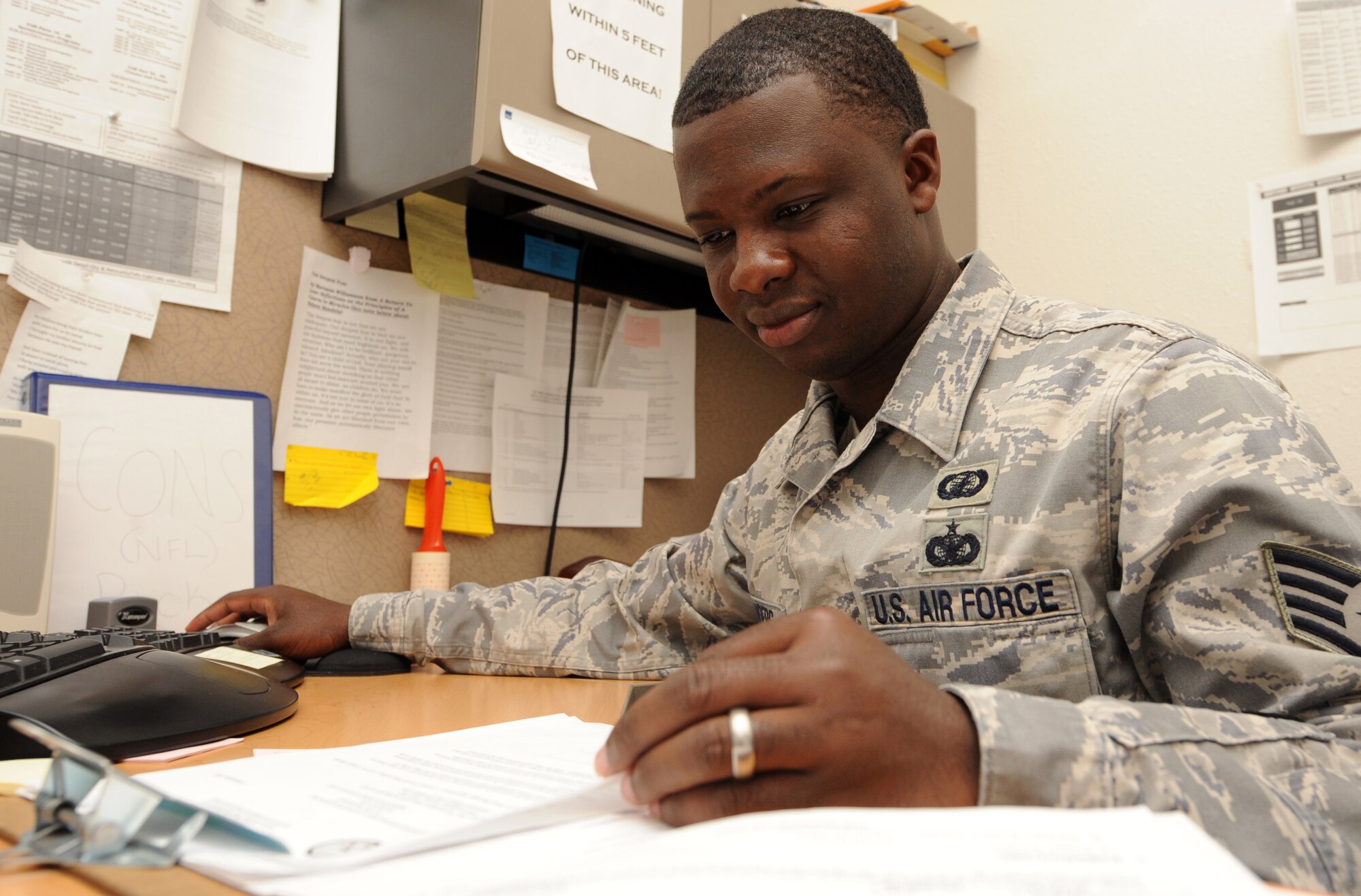 MOUNTAIN HOME AIR FORCE BASE, Idaho -- Staff Sgt Carlos Sanders, 366th Contracting Squadron service contract specialist, reviews information regarding a contract for end of year Sept 10. The Contracting Squadron provides business advice and an overall base acquisition program to support the 366th Fighter Wing’s contracting needs. (U.S. Air Force photo by Senior Airman Debbie Lockhart)