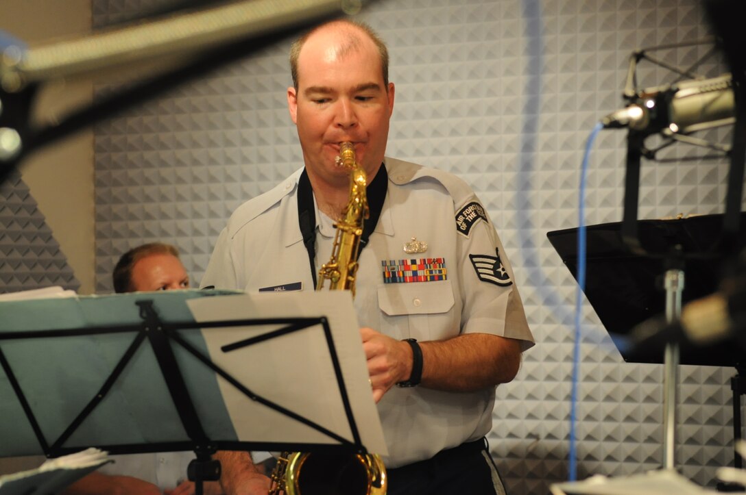 SSgt Jeff Hall, a saxophonist with the USAF Band of the Pacific, performs during a live radio broadcast from Fairbanks, AK.  The Band of the Pacific's 'Dixie Express' were featured on KUAC radio's broadcast "Alaska Live", a program which features live in-studio performances of musicians touring in Alaska. (U.S. Air Force photo/Lisa Scerbak)