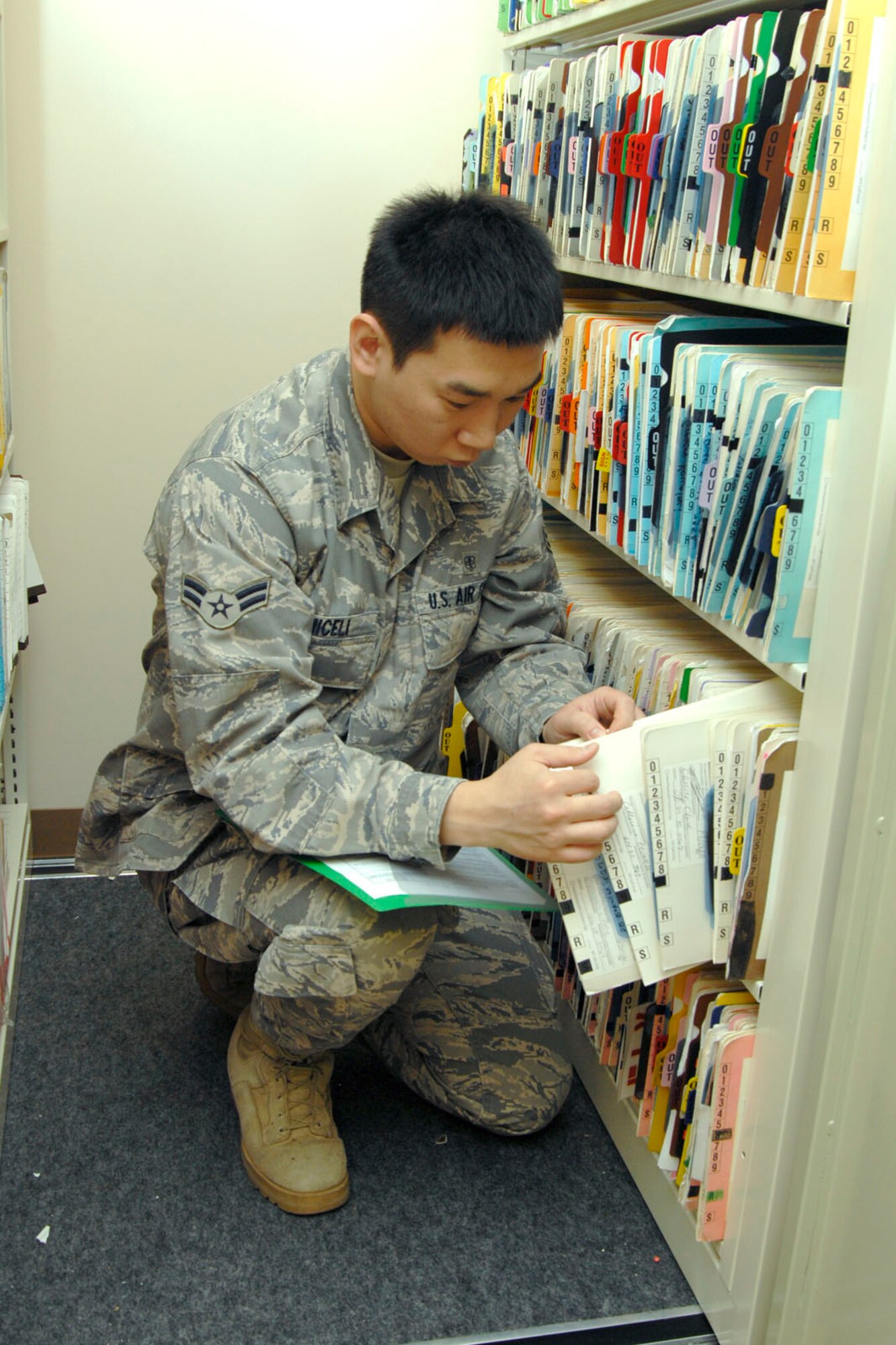 JOINT BASE ELMENDORF RICHARDSON, Alaska -- Airman First Class Daniel Miceli, a dental technician for the 176th Medical Group, files medical records here on Sept. 19, 2010. The Medical Group was one the first units from the 176th Wing to relocate here from Kulis Air National Guard Base. All wing units will eventually relocate here as part of the Federal 2005 Base Realignment and Closure (BRAC) legislation; most of the remaining units will make the move in early 2011. Alaska Air National Guard photo by Master Sgt. Shannon Oleson.