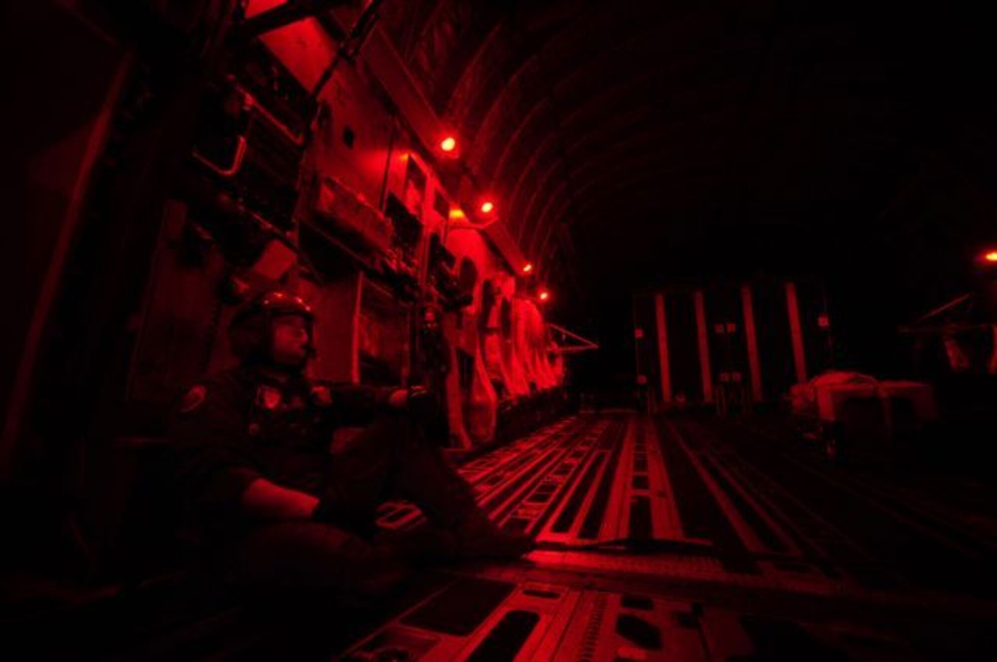 U.S. Air Force C-17 Globemaster III Loadmaster Staff Sgt. Lucas Crumpton with the 535th Airlift Squadron from Hickam Air Force Base (AFB), H.I., takes a seat while in-flight before an airborne insertion during Joint Forcible Entry Exercise at Pope Air Force Base, N.C., Sept. 14, 2010.  Joint Forcible Entry Exercise is a training event held six times a year in order to enhance cohesiveness between the Air Force and Army by executing large scale heavy equipment and troop movement for real world contingencies. (U.S. Air Force photo/Staff Sgt. Angelita M. Lawrence)
