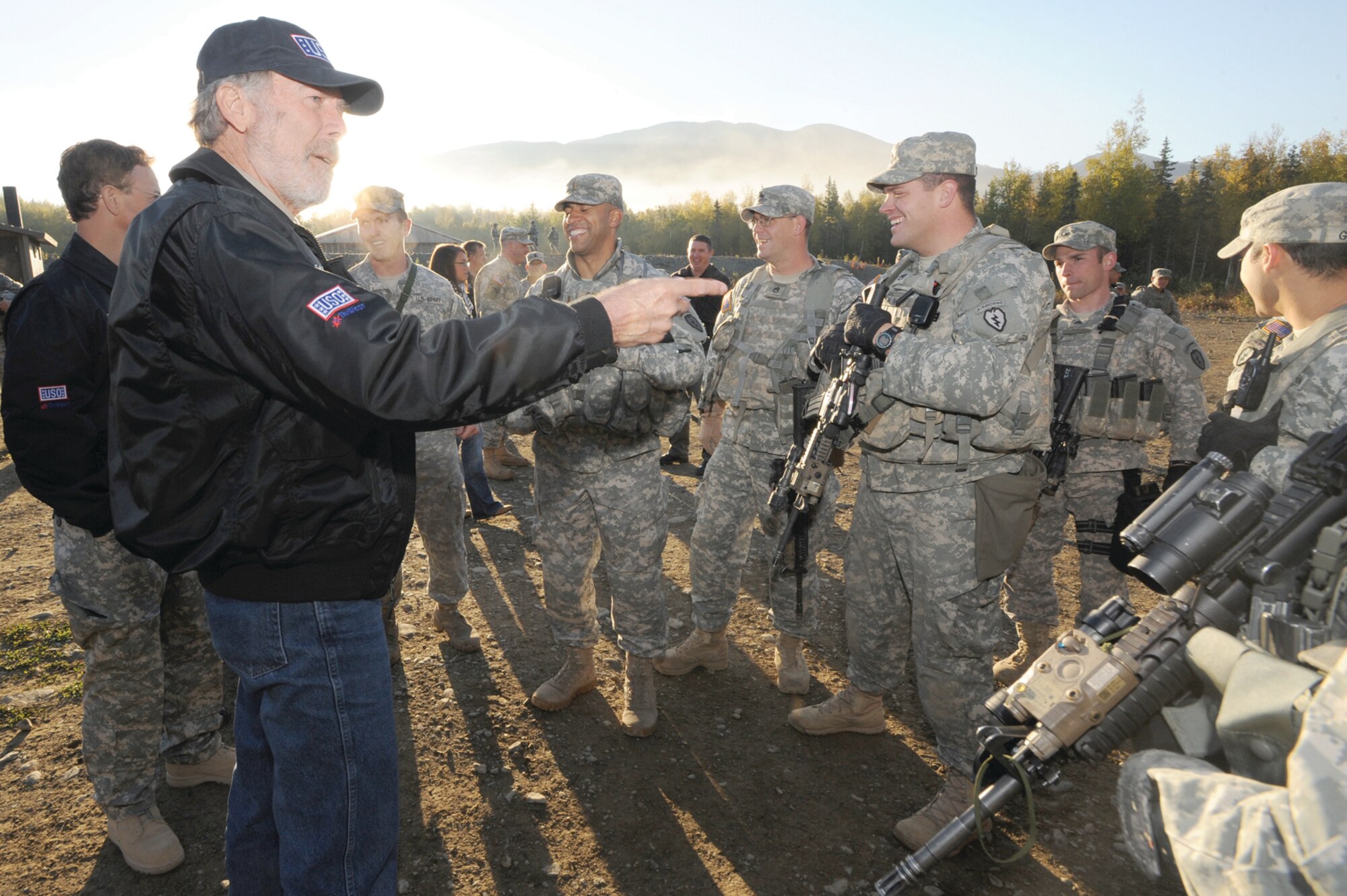 Medal of Honor recipient Drew Dix talks with Soldiers of 1st Battalion, 501st Infantry Regiment (Airborne), during his USO visit with actor Gary Sinise to Joint Base Elmendorf-Richardson, Sept. 16. Dix and Sinise were able to talk with military personnel from the Army and Air Force during the visit. The visit allowed JBER members to showcase the Arctic Warriors’ capabilities to Sinise and Dix. 
The Lieutenant Dan Band, presented by the USO, headlined at Hangar 20, Sept. 16, playing cover tunes ranging from classic rock to country music. Members of the band met with Airmen and Soldiers before their performance, firing M-4 carbines with the 1-501st, flying on a UH-60 Black Hawk with 207th Aviation Regiment, Alaska Army National Guard, and meeting with families of the Sitka 43 crash. (Photo by Air Force Staff Sgt. Joshua Garcia/JBER PAO)