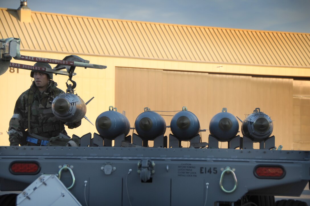 ELLSWORTH AIR FORCE BASE, S.D. -- Airman 1st Class James Jones, 28th Munitions Squadron weapons crew member, loads munitions for transport during a Phase II Operational Readiness Exercise, Sept. 16.  The exercise is designed to test Airmen on their abilities in a simulated deployed environment. (U.S. Air Force photo/Airman 1st Class Anthony Sanchelli)
