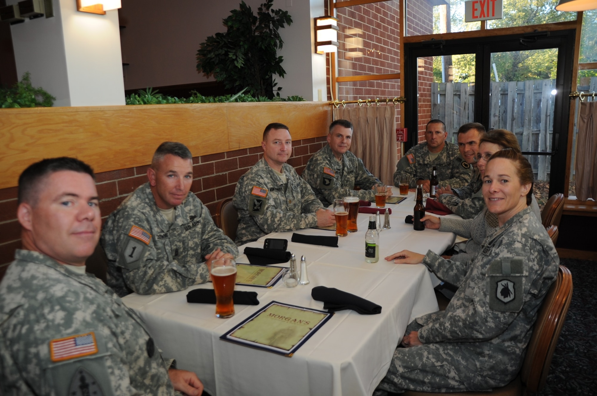 Soldiers from the 98th Division (Institutional Training) relax as they wait for their evening meal opening night at Morgan’s Steakhouse Sept. 17. (U.S. Air Force photo/Pascual Flores)