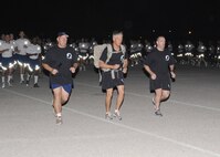 Former prisoner of war and retired Air Force Col. Joseph Milligan (left), 37th Training Wing commander Col. William H. Mott V (center) and 324th Training Squadron commander Lt. Col. George Irving begin the 24-hour run. (U.S. Air Force photo/Alan Boedeker)
