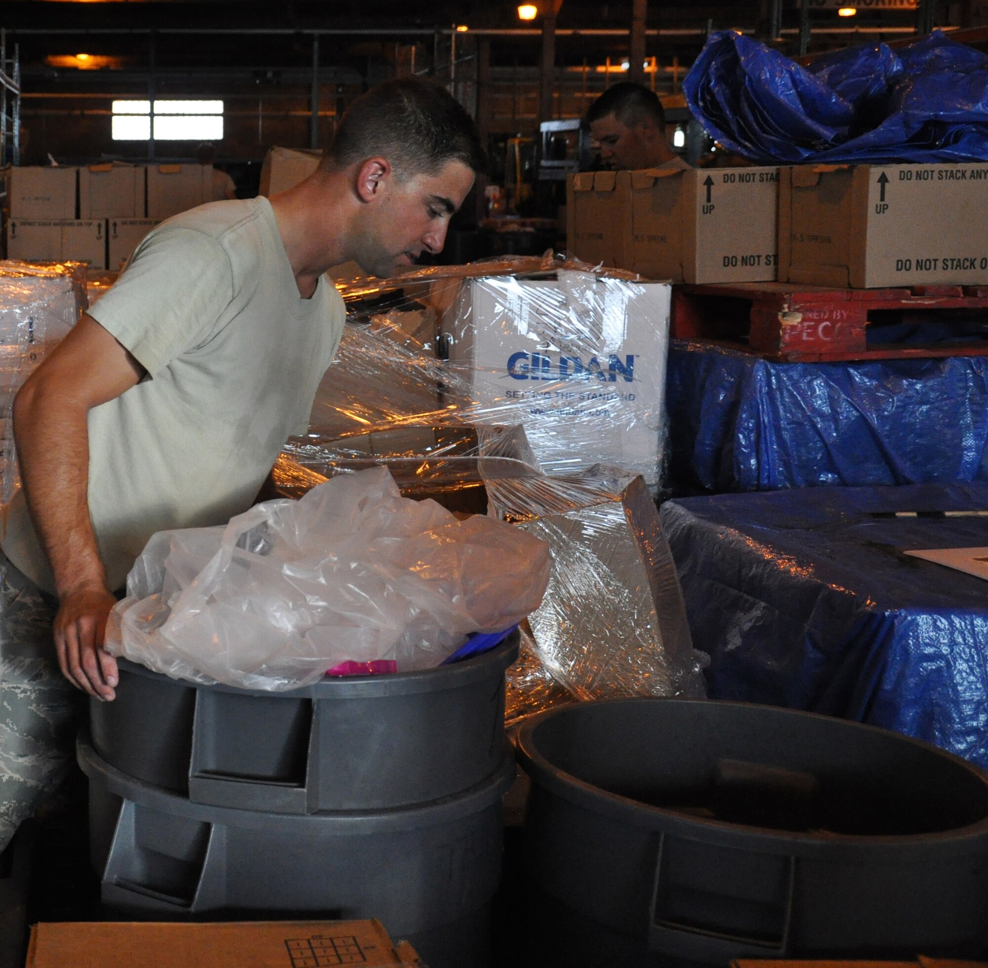WRIGHT-PATTERSON AIR FORCE BASE, Ohio - Airman 1st Class Adam Miller, 445th Security Forces Squadron, sorts through various items in the Air Force Marathon warehouse that were leftover from the Sept. 18 Air Force Marathon. (U.S. Air Force photo/Staff Sgt. Robert Nelson)