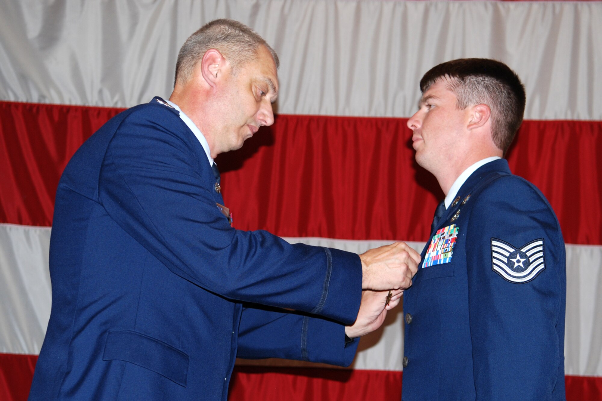 Col. John J. Mooney III, commander of the 917th Wing, pins The Bronze Star Medal on Technical Sgt. Jay Futrell, 917th Explosive Ordnance Disposal (EOD) Flight, during award ceremonies in Hoban Hall at Barksdale Air Force Base, La., Sept. 12, 2010. Sergeant Futrell was awarded the medal for service while deployed to the 755th Bravo EOD Flight in Afghanistan from Sept. 30, 2009 to March 31, 2010. (U.S. Air Force photo/Master Sgt. Greg Steele)