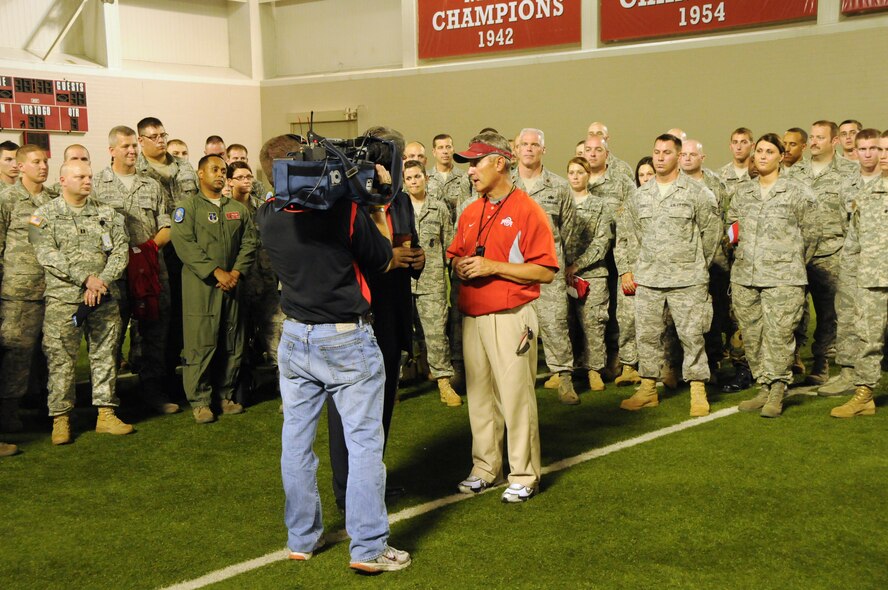 Ohio State University football coach Jim Tressel speaks with the media after practice while members of the Ohio Air and Army National Guard look on Sept. 22, 2010.
Over 100 Servicemembers were invited to attend a meet and greet with the Ohio State University football team.