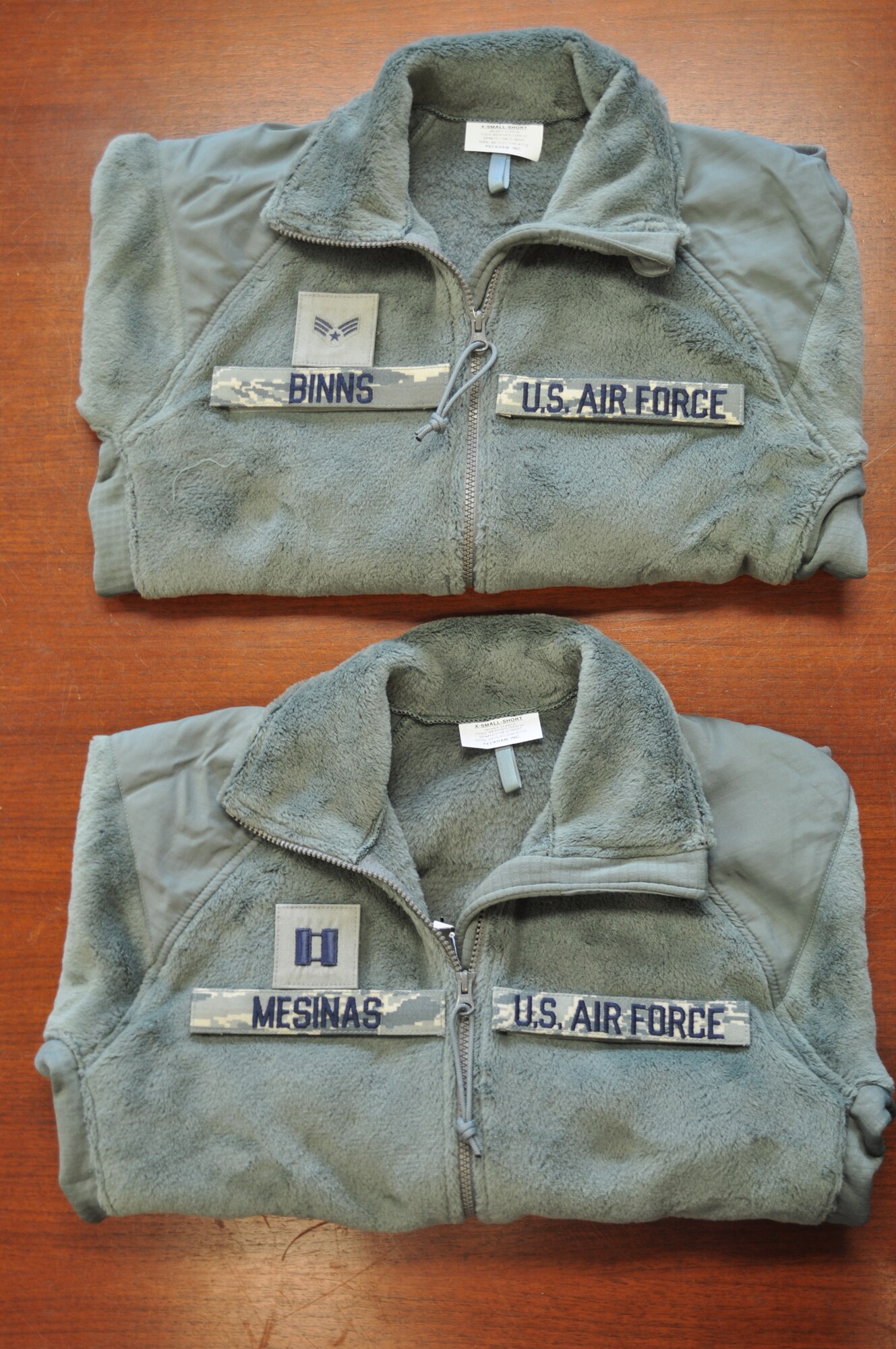 As of Oct. 1, Airmen will be required to have rank, name, and service designator affixed to the sage green fleece. (U.S. Air Force photo)