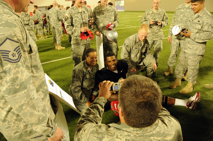 Ohio State quarterback Terrele Prior signs his autograph for an Ohio Air National Guard servicemember Sept. 22, 2010 during a meet and greet with the Ohio State University football team.