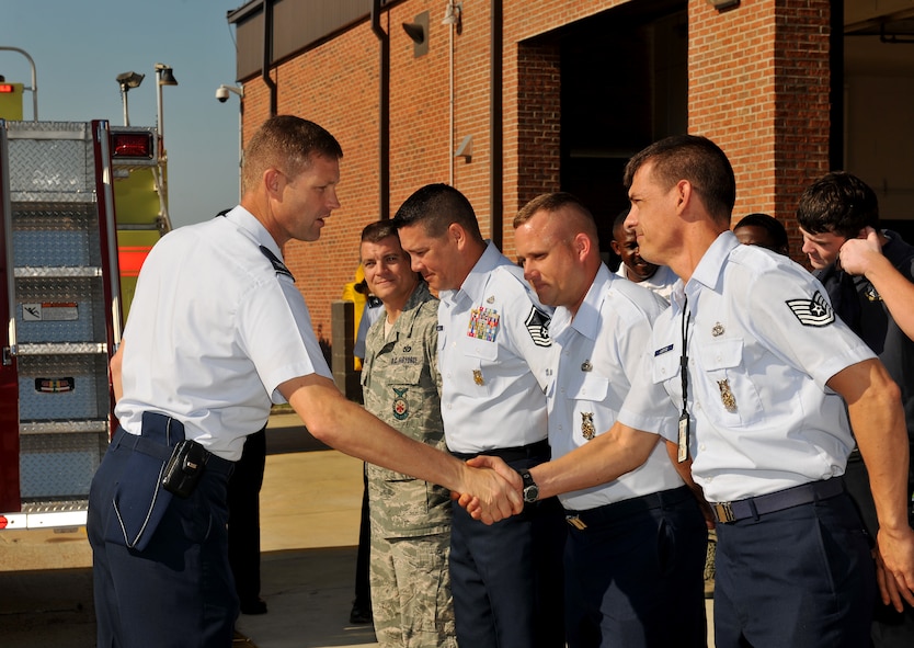 MOODY AIR FORCE BASE, Ga. -- Col. Gary Henderson, 23rd Wing commander, shakes hands with Airmen from the 23rd Civil Engineer Squadron Emergency Services flight during a proclamation signing here Sept. 20. Fire Prevention Week at Moody will be observed Oct. 3-9 and its goal is to increase the awareness of fire prevention and safety. (U.S. Air Force photo/Airman 1st Class Joshua Green)
