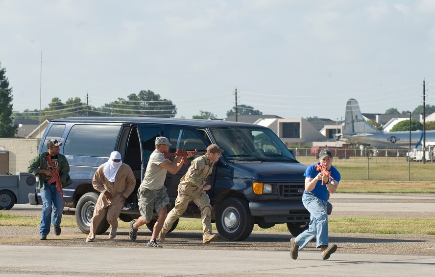 BARKSDALE AIR FORCE BASE, La. -- Five simulated attackers attempt to take over a B-52 Stratofortress during a nuclear surety exercise Sept. 22. The NSE is designed to ensure Barksdale's ability to execute nuclear operations in a safe, secure and reliable manner. (U.S. Air Force photo/Senior Airman Chad Warren) 