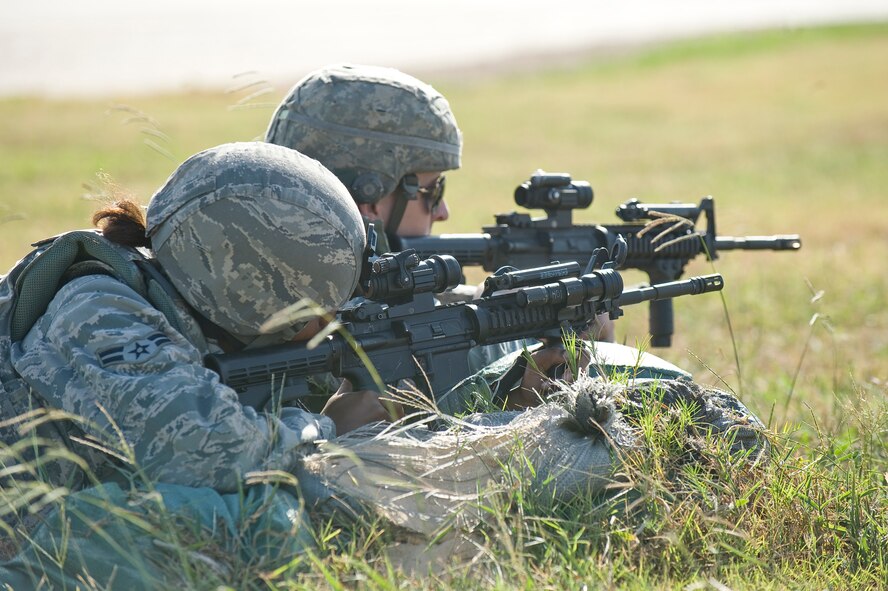 BARKSDALE AIR FORCE BASE, La. -- Two Airmen assigned to the 2nd Security Forces Squadron provide security for a B-52 Stratofortress during a nuclear surety exercise Sept. 22. The NSE is designed to ensure Barksdale's ability to execute nuclear operations in a safe, secure and reliable manner. (U.S. Air Force photo/Senior Airman Chad Warren)