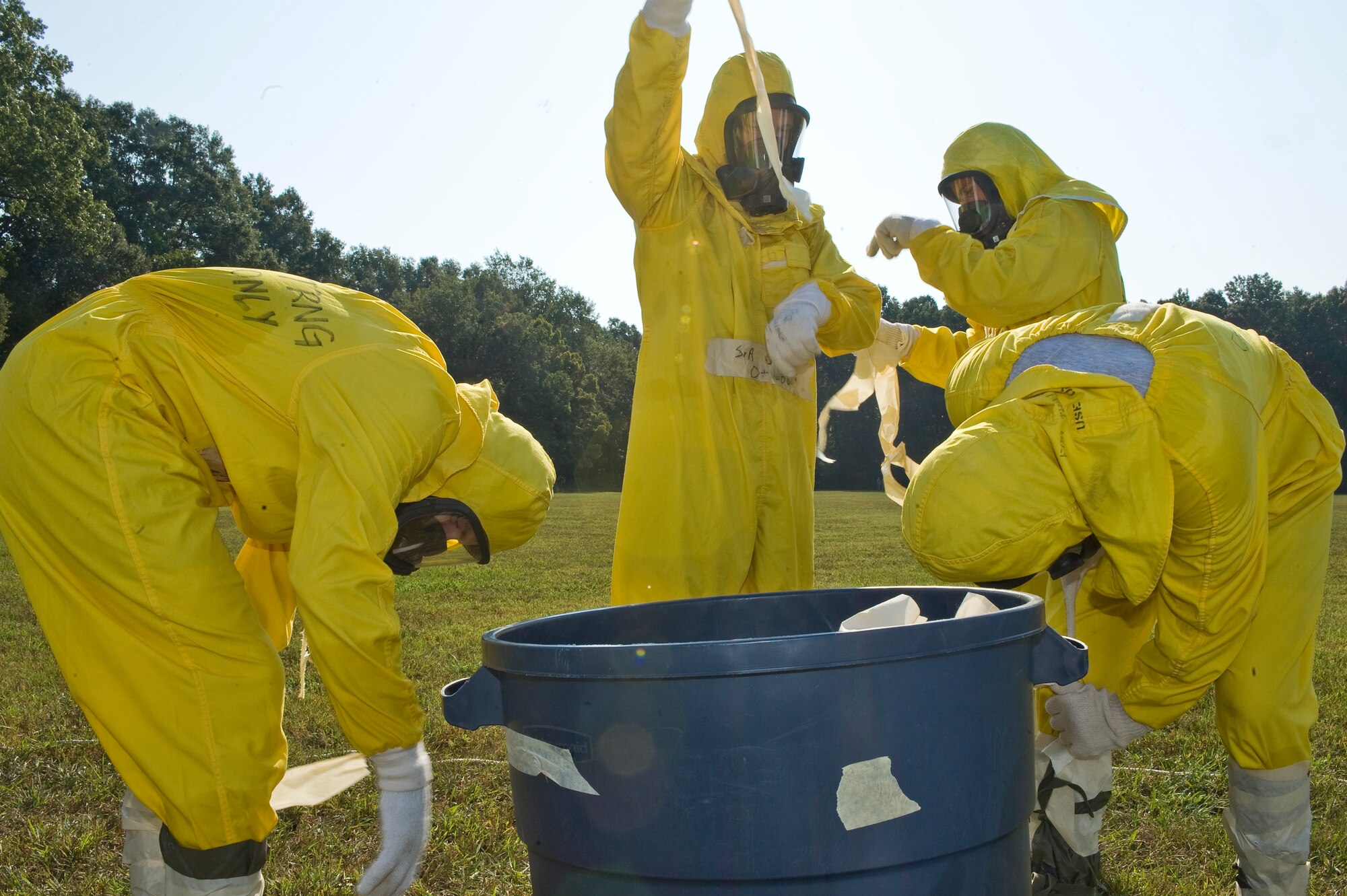 BARKSDALE AIR FORCE BASE, La. -- Explosive Ordnance Disposal team members assigned to the 2nd Civil Engineer Squadron remove their chemical suits after a scenario during a nuclear surety exercise Sept. 21. The NSE is designed to ensure Barksdale's ability to execute nuclear operations in a safe, secure and reliable manner. (U.S. Air Force photo/Senior Airman Chad Warren) 