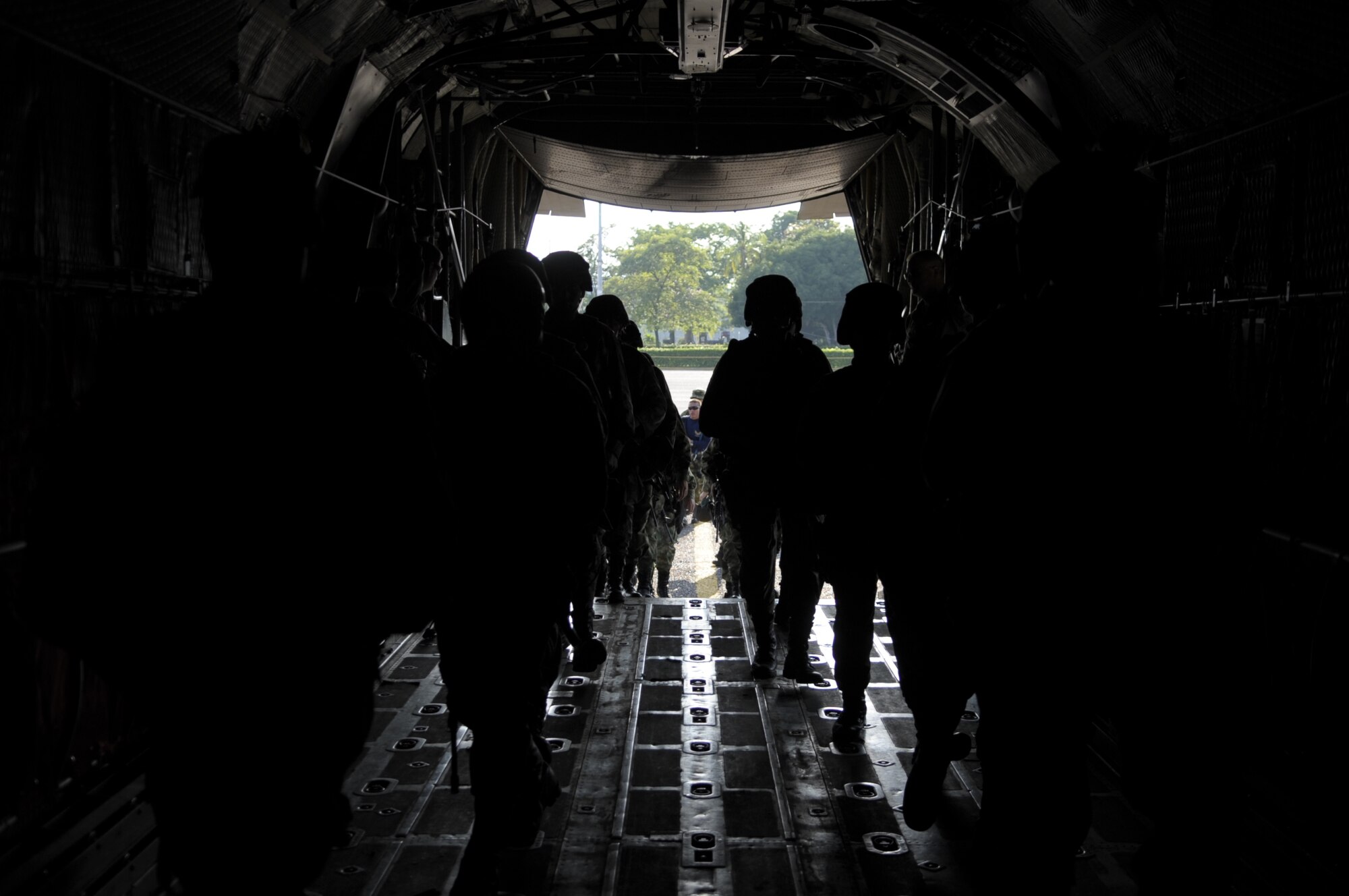PALANQUERO AIR BASE, Colombia -- Colombian air force commandos run into the back of a C-130 during an exercise Sept. 16 here.  The exercise was one of many during a weeklong subject matter expert exchange between Airmen from Moody’s rescue community and Colombian air force C-130 crews here.  