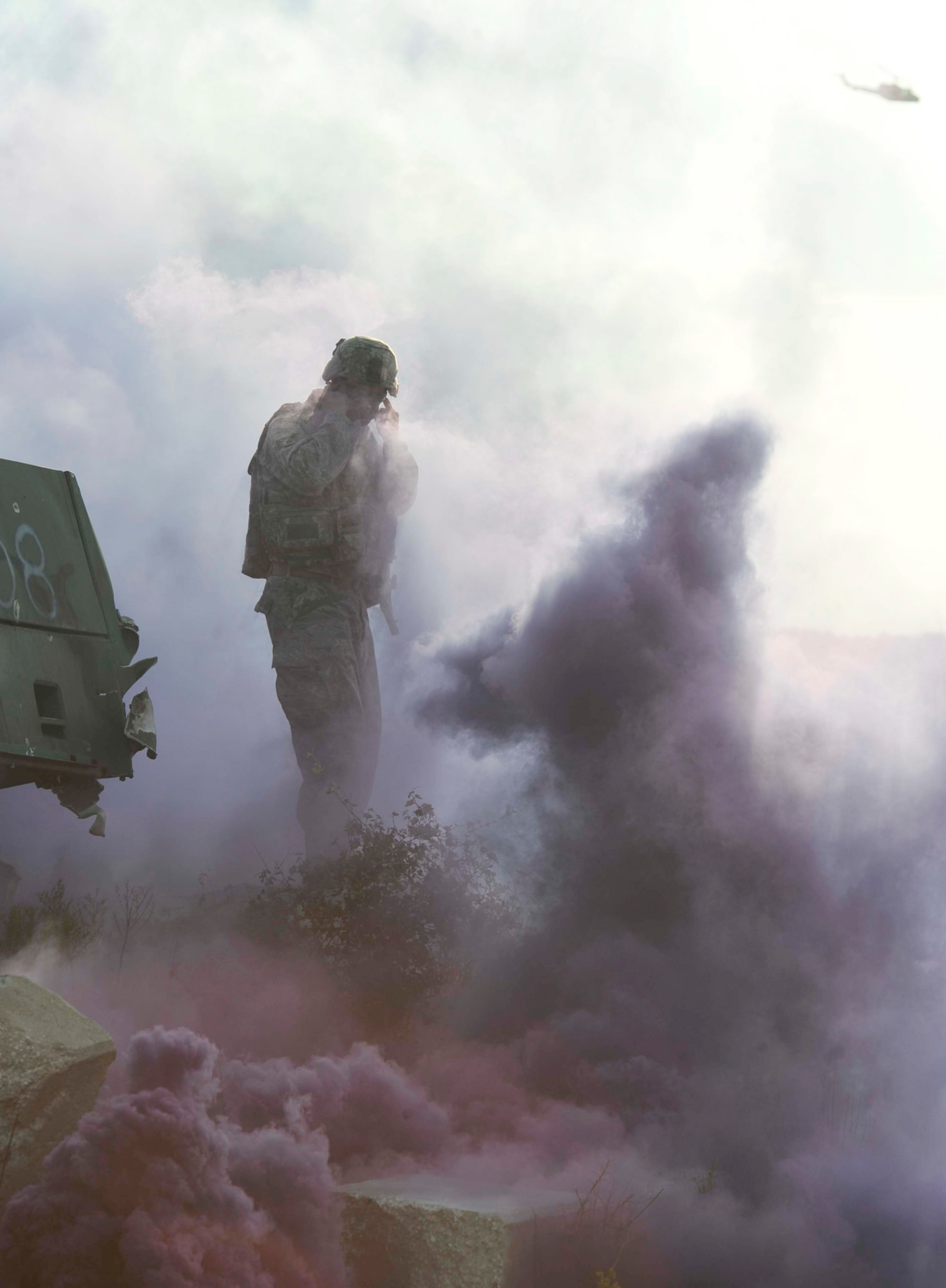 Staff Sgt. Michaelson "pops" a smoke bomb during exercise Atlantic Strike 10-02 Sept. 14, 2010, in Avon Park, Fla.  Popping smoke is one of the ways the team leads get the joint terminal attack controller and joint fires observer to have a sense of urgency. Atlantic Strike is a biannual Air Combat Command sponsored joint training exercise designed for the tactical employment of air power in support of joint terminal attack controller and joint fires observer integration through close air support. (Air Force photo/Staff Sgt. Patrick Mitchell)

