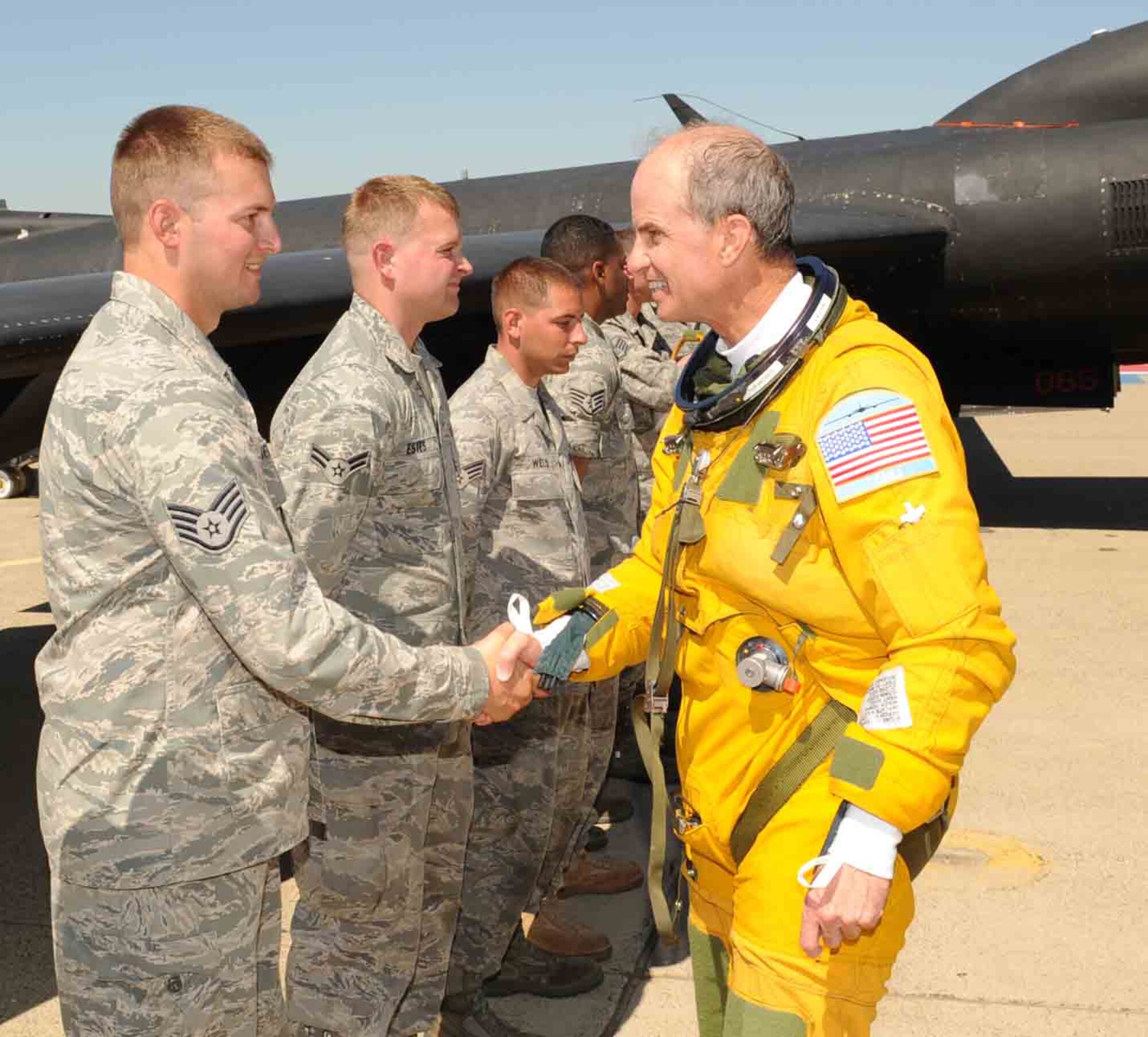 Gen. Kevin Chilton, commander, U.S. Strategic Command, shakes hands with 9th Aircraft Maintenance Squadron Airmen after completing his high flight in the U-2 Dragon Lady. The U-2 is a high altitude intelligence, surveillance and reconnaissance aircraft that can fly at 70,000 feet, and the pilots have to wear a special pressure suit to protect themselves from the extreme high altitudes. General Chilton visited Beale Air Force Base, Sept. 9-11. During his visit the general was a guest speaker during for a reunion of current and former U-2 pilots, maintainers and support staff associated with the U-2 program. In addition to being a guest speaker at the reunion, he saw firsthand how the remotely piloted aircraft RQ-4 Global Hawk provides high altitude intelligence surveillance and reconnaissance to forward deployed warfighters. 

“Global Hawk will continue to bring a broad range of ISR collection capabilities that support the joint war fighter in real time contingency and wartime operations for decades,” said General Chilton. “As a result, we can expect to see dramatic increases in operational demand for these assets.”