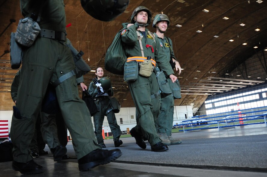 ELLSWORTH AIR FORCE BASE S.D. – Aircrew members from the 37th Bomb Squadron depart for a mission during a Phase II Operational Readiness Exercise, Sept. 16. An aircrew is comprised of a four-man crew which includes the pilot, co-pilot, defensive systems operator and offensive systems operator. (U.S. Air Force photo/Senior Airman Corey Hook)